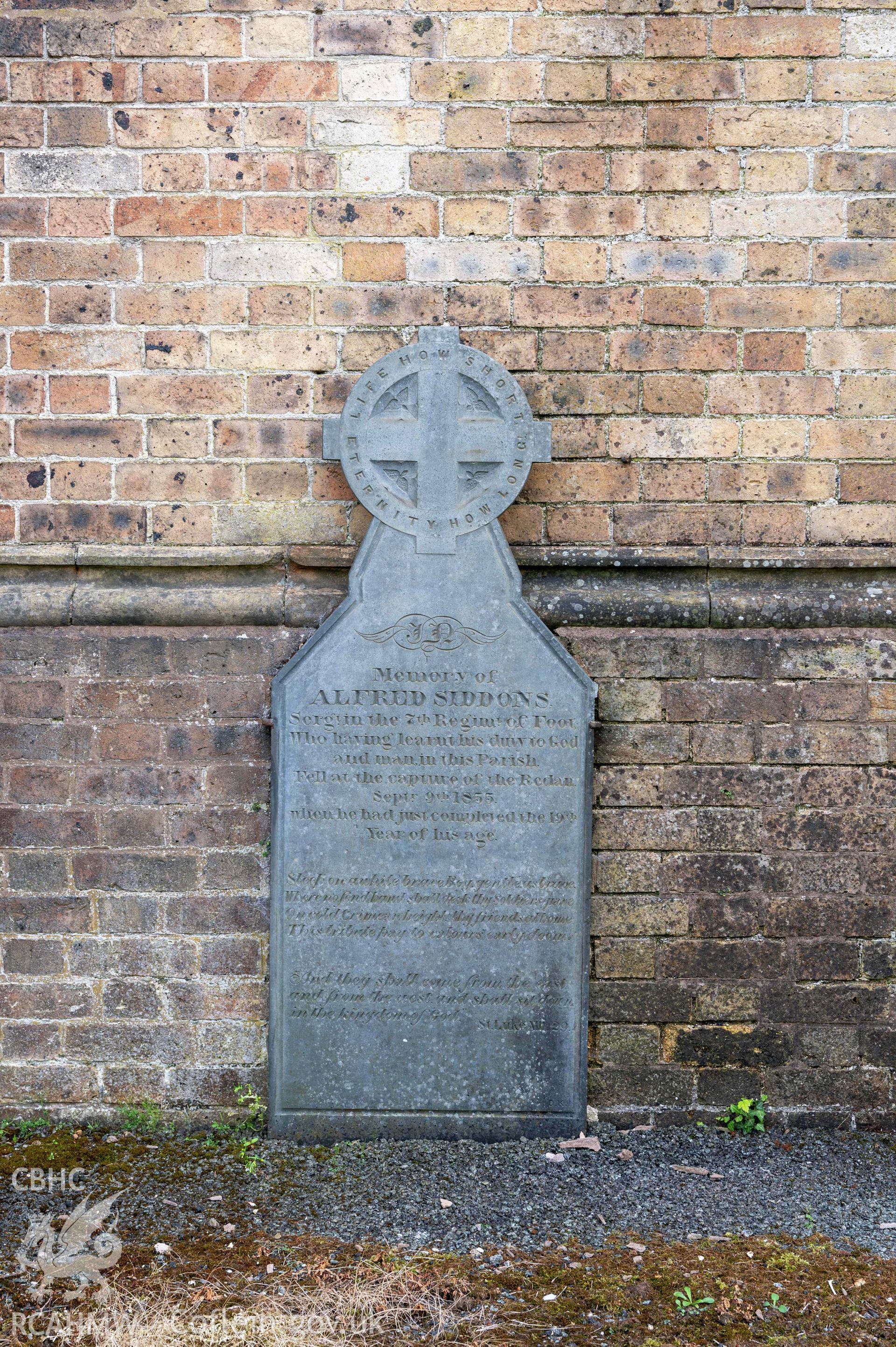 St David's Church, Newtown - detail of gravestone at base of south-west elevation of western tower.