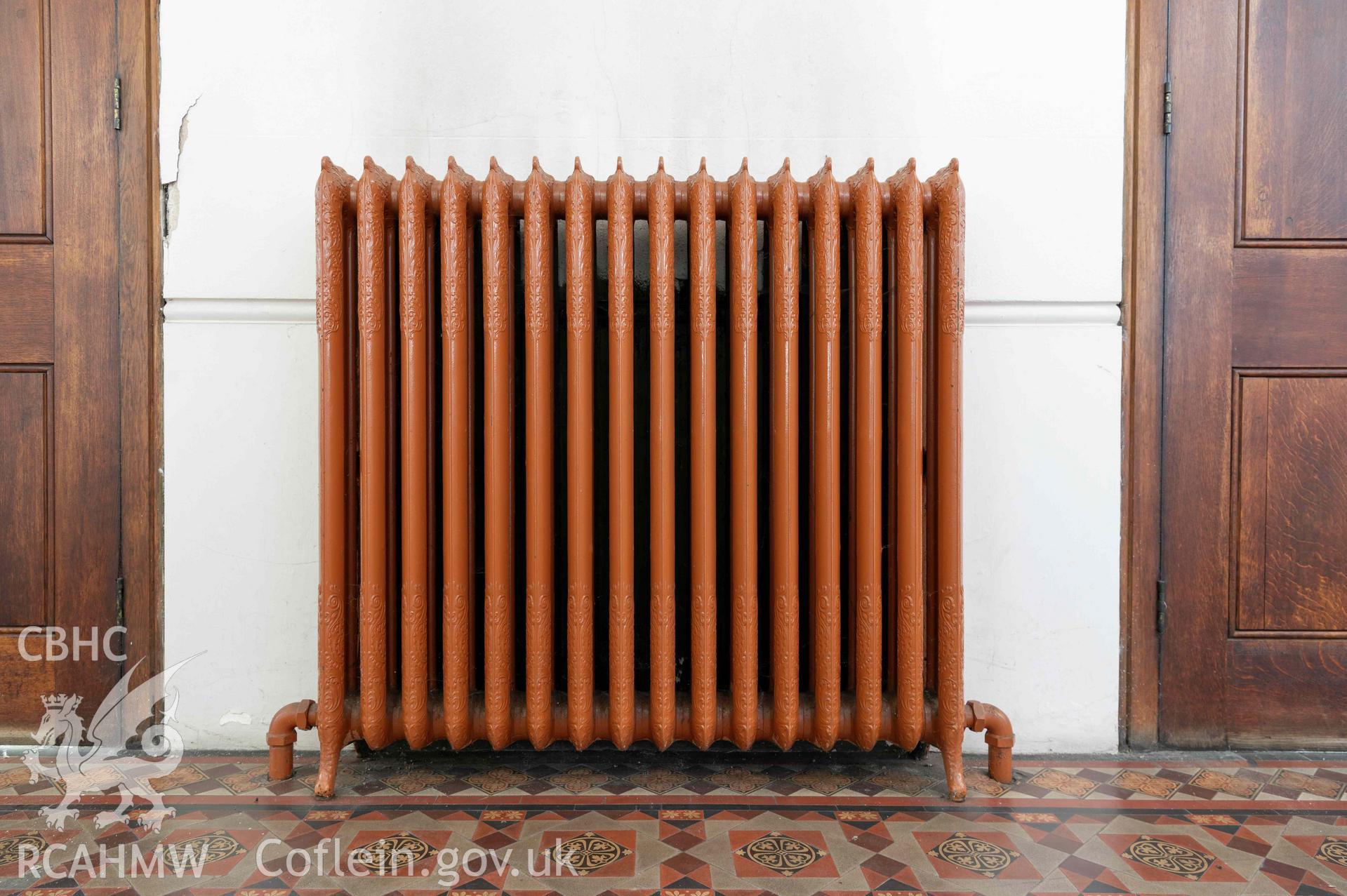 Capel Zion Baptist Chapel, Newtown - vestibule, detail of cast iron radiator.