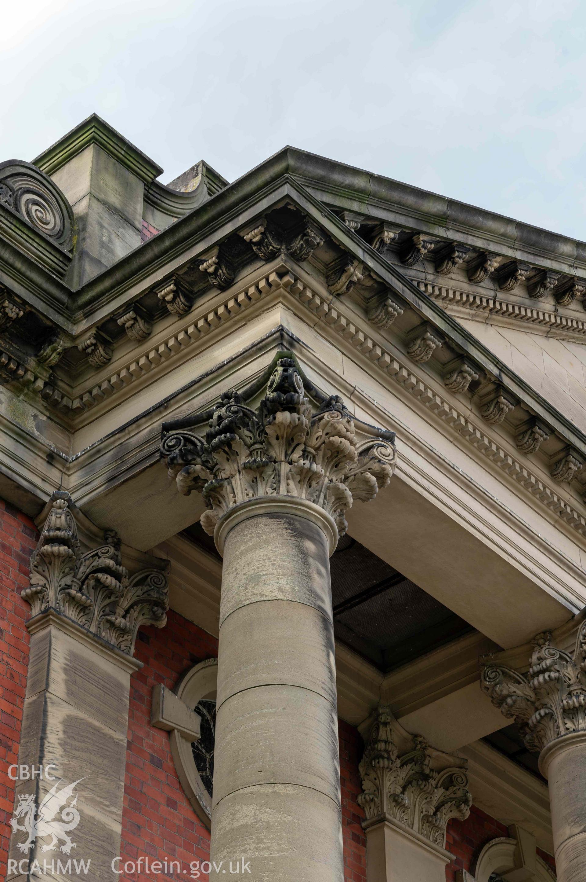 Capel Zion Baptist Chapel, Newtown - exterior detail of pediment cornice and Corinthian capitals.