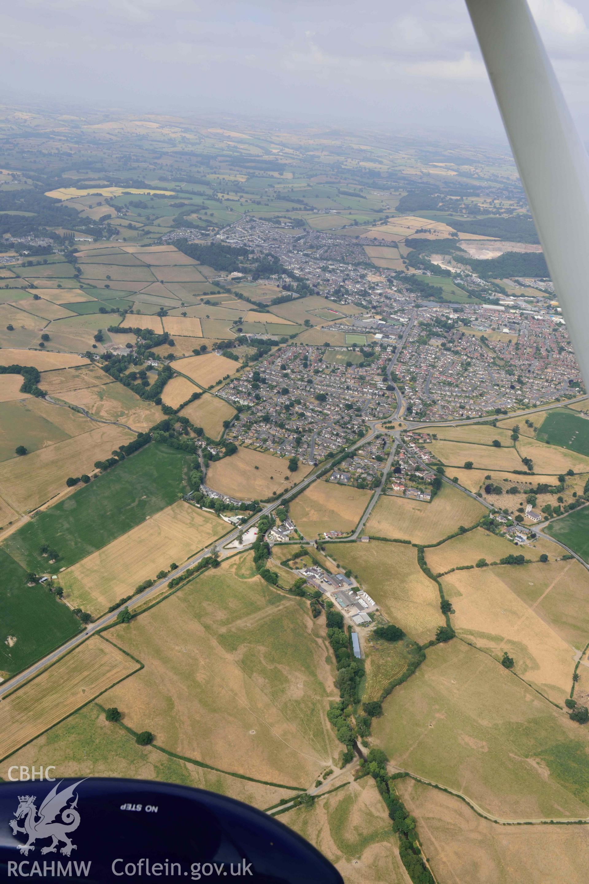 Denbigh Town with cropmarks from the south east. Oblique aerial photograph taken during the Royal Commission