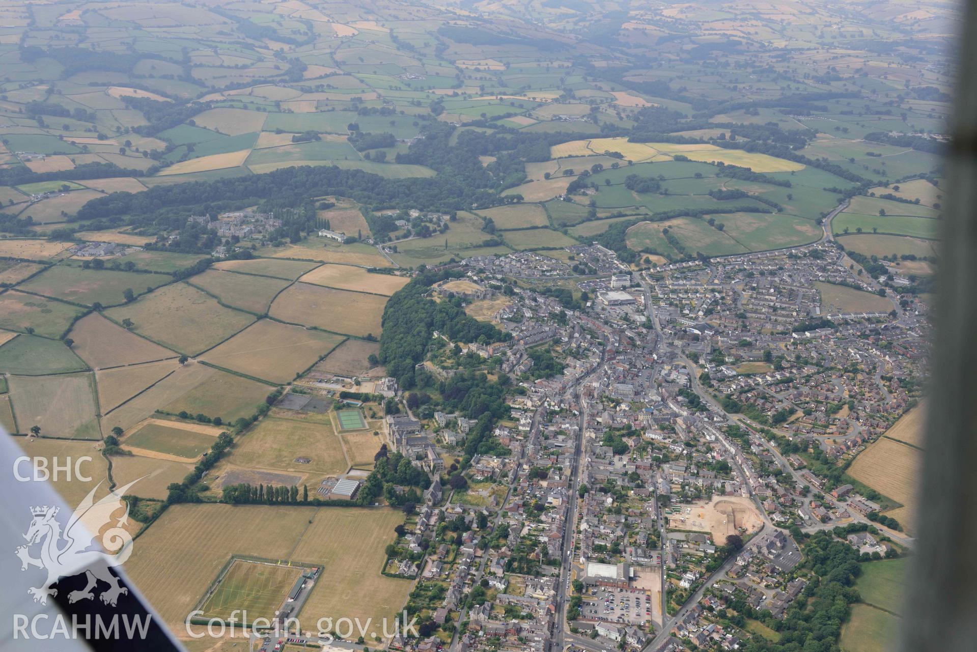 Denbigh Town with cropmarks from the south east. Oblique aerial photograph taken during the Royal Commission