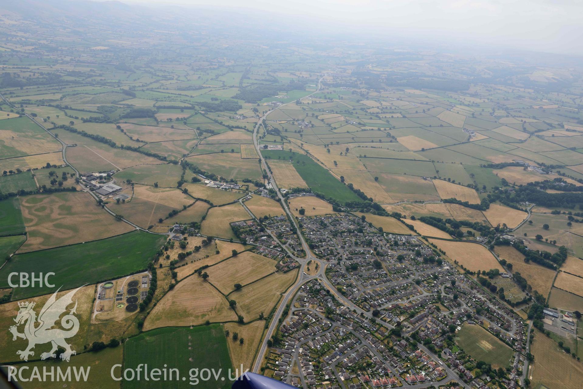 Denbigh Town with cropmarks from the south east. Oblique aerial photograph taken during the Royal Commission