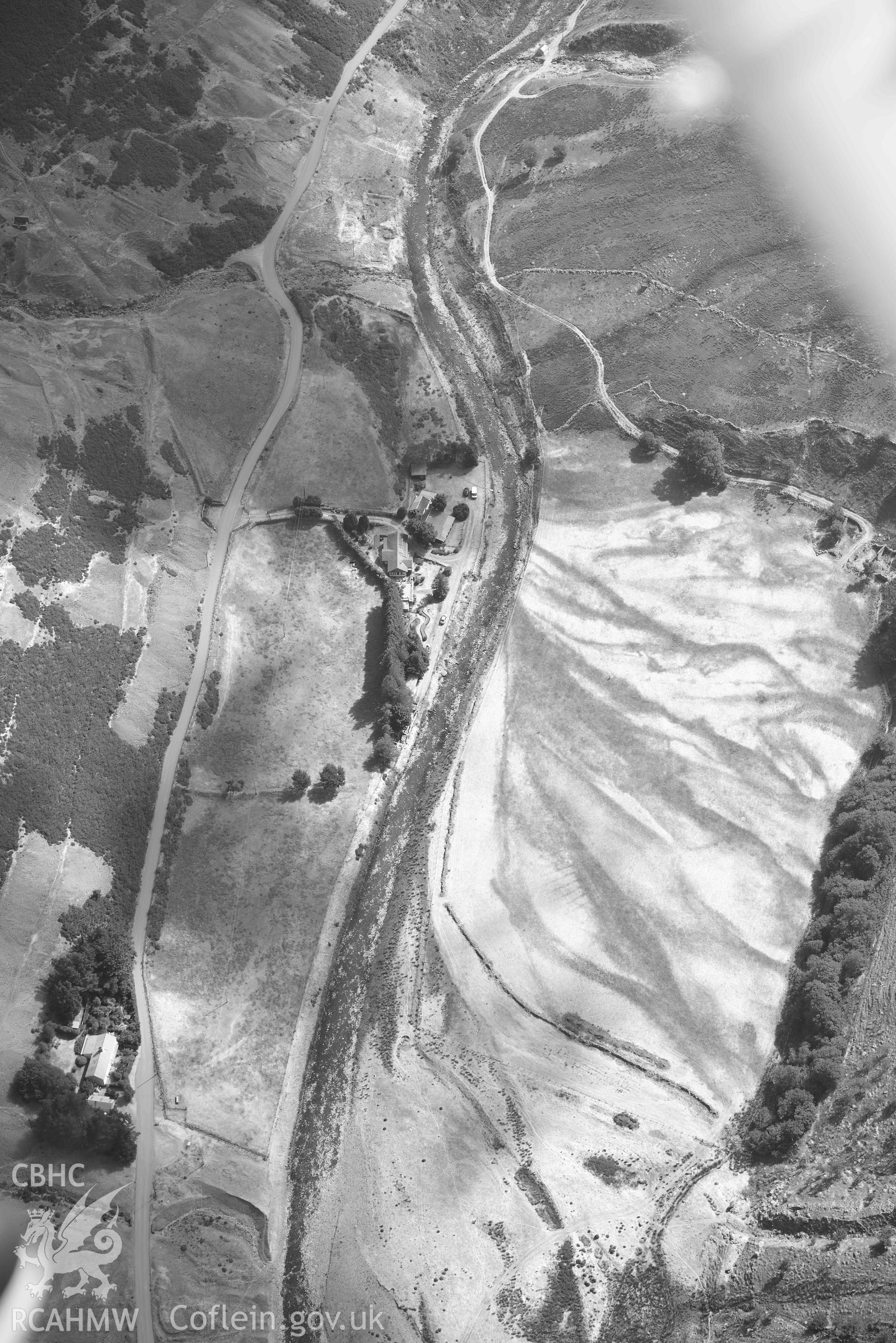 Cwmystwyth lead mines and Banc Tynddol Bronze Age Burial. Oblique black and white aerial photograph taken during the Royal Commission’s programme of archaeological aerial reconnaissance by Toby Driver on 10 July 2018.