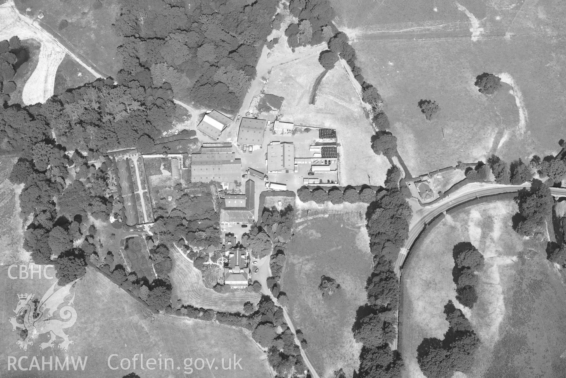 Site of gardens and nunnery at Llanllyr. Oblique black and white aerial photograph taken during the Royal Commission’s programme of archaeological aerial reconnaissance by Toby Driver on 10 July 2018.