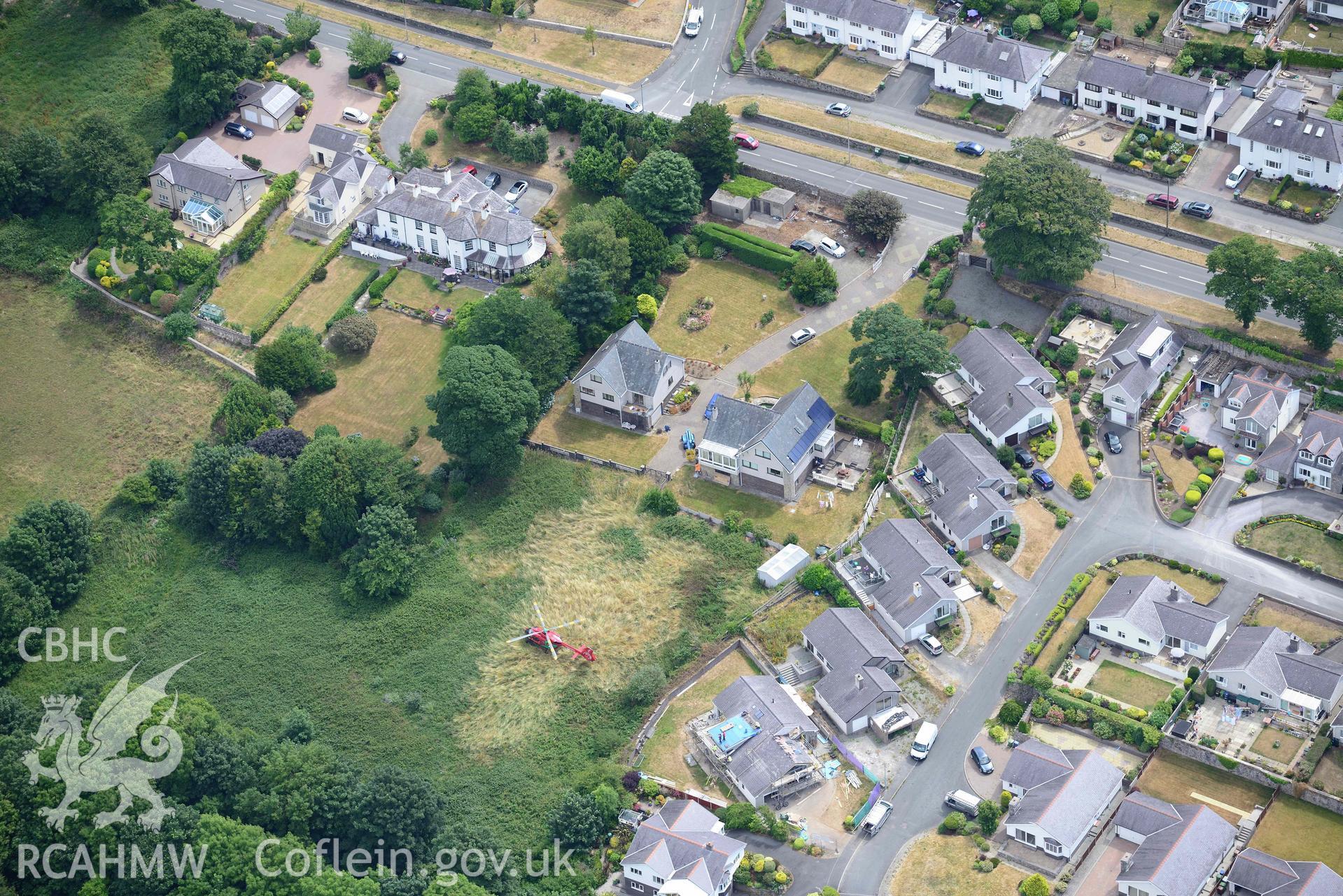 Air ambulance in Waterloo Port, Caernarfon. Oblique aerial photograph taken during the Royal Commission’s programme of archaeological aerial reconnaissance by Toby Driver on 10 July 2018.