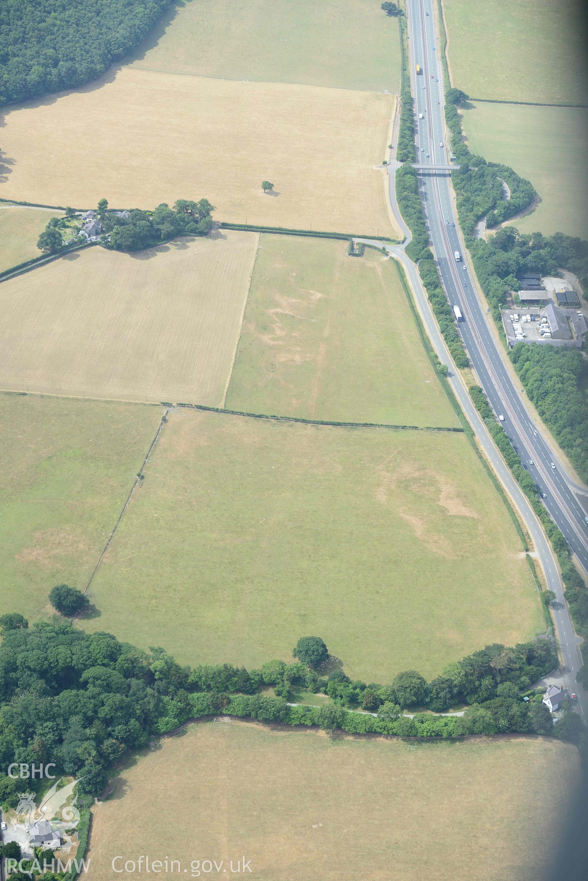 Madryn Roman Road. Oblique aerial photograph taken during the Royal Commission’s programme of archaeological aerial reconnaissance by Toby Driver on 10 July 2018.