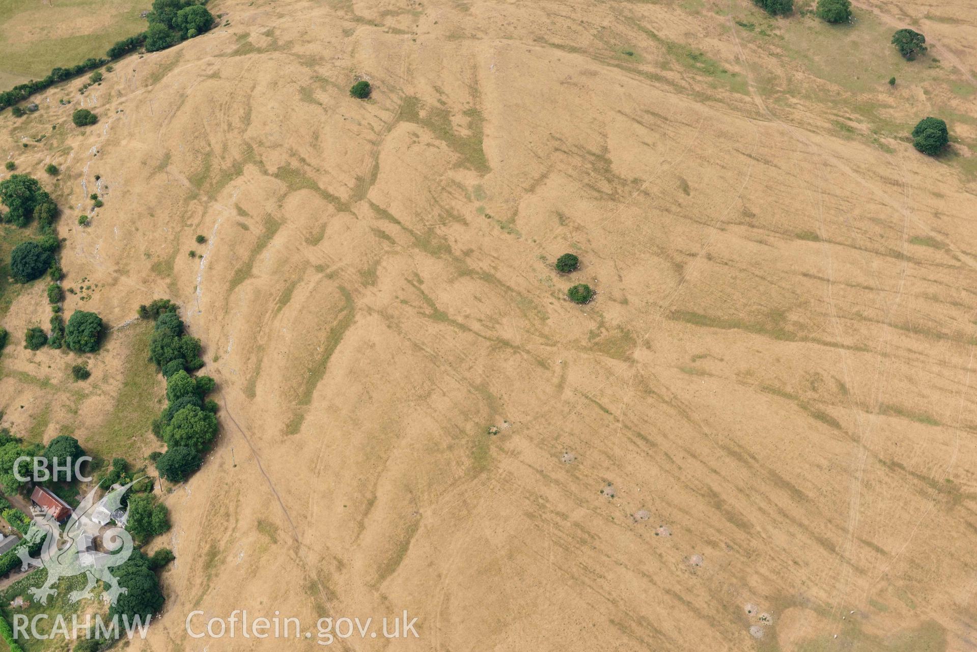 Marian Ffrith enclosure. Oblique aerial photograph taken during the Royal Commission’s programme of archaeological aerial reconnaissance by Toby Driver on 10 July 2018.