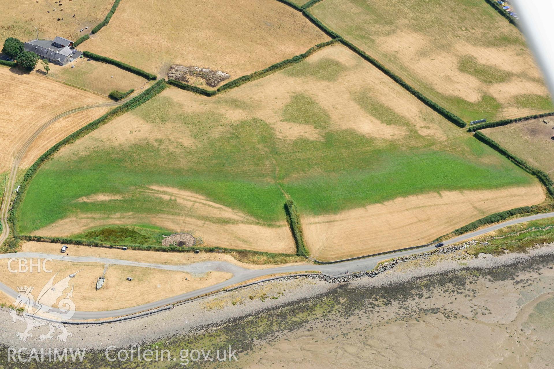 Glan y Mor cropmarks. Oblique aerial photograph taken during the Royal Commission’s programme of archaeological aerial reconnaissance by Toby Driver on 10 July 2018.