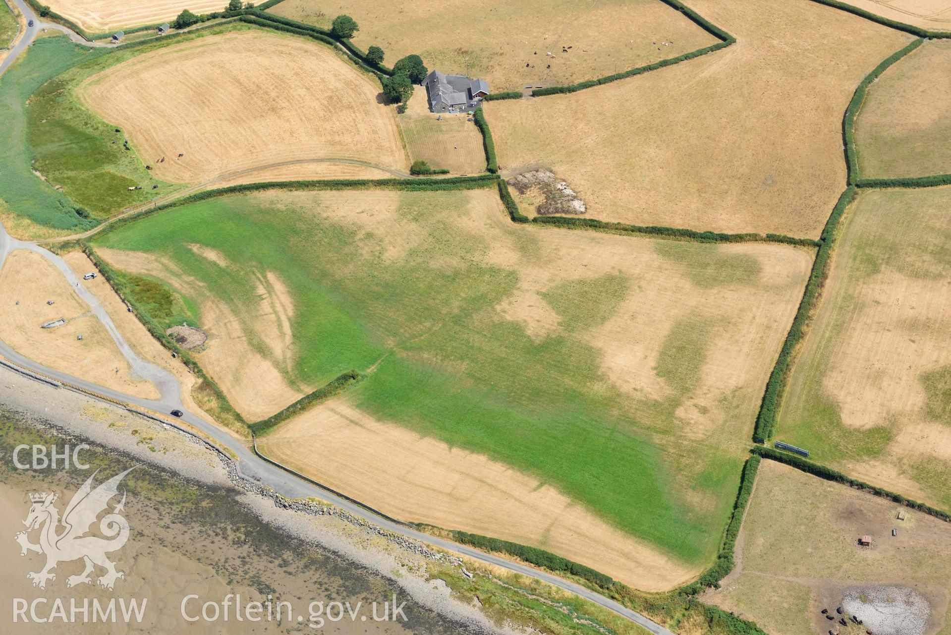 Glan y Mor cropmarks. Oblique aerial photograph taken during the Royal Commission’s programme of archaeological aerial reconnaissance by Toby Driver on 10 July 2018.