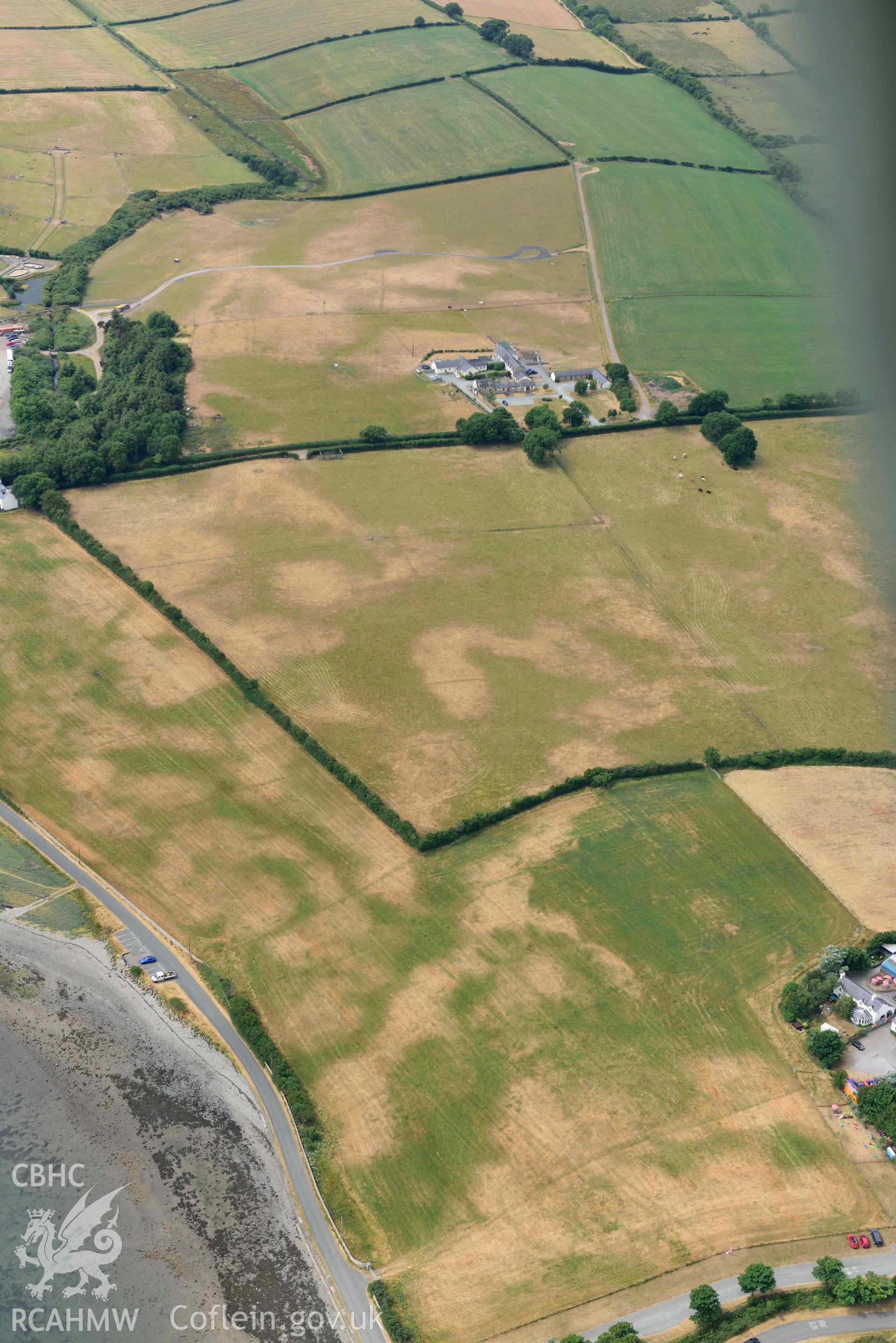 Plas Farm early field systems. Oblique aerial photograph taken during the Royal Commission’s programme of archaeological aerial reconnaissance by Toby Driver on 10 July 2018.