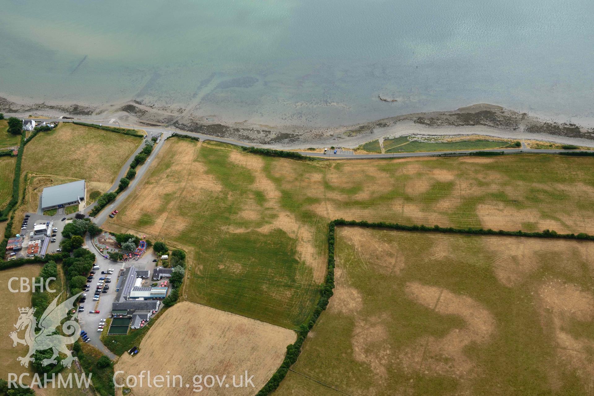 Plas Farm early field systems. Oblique aerial photograph taken during the Royal Commission’s programme of archaeological aerial reconnaissance by Toby Driver on 10 July 2018.