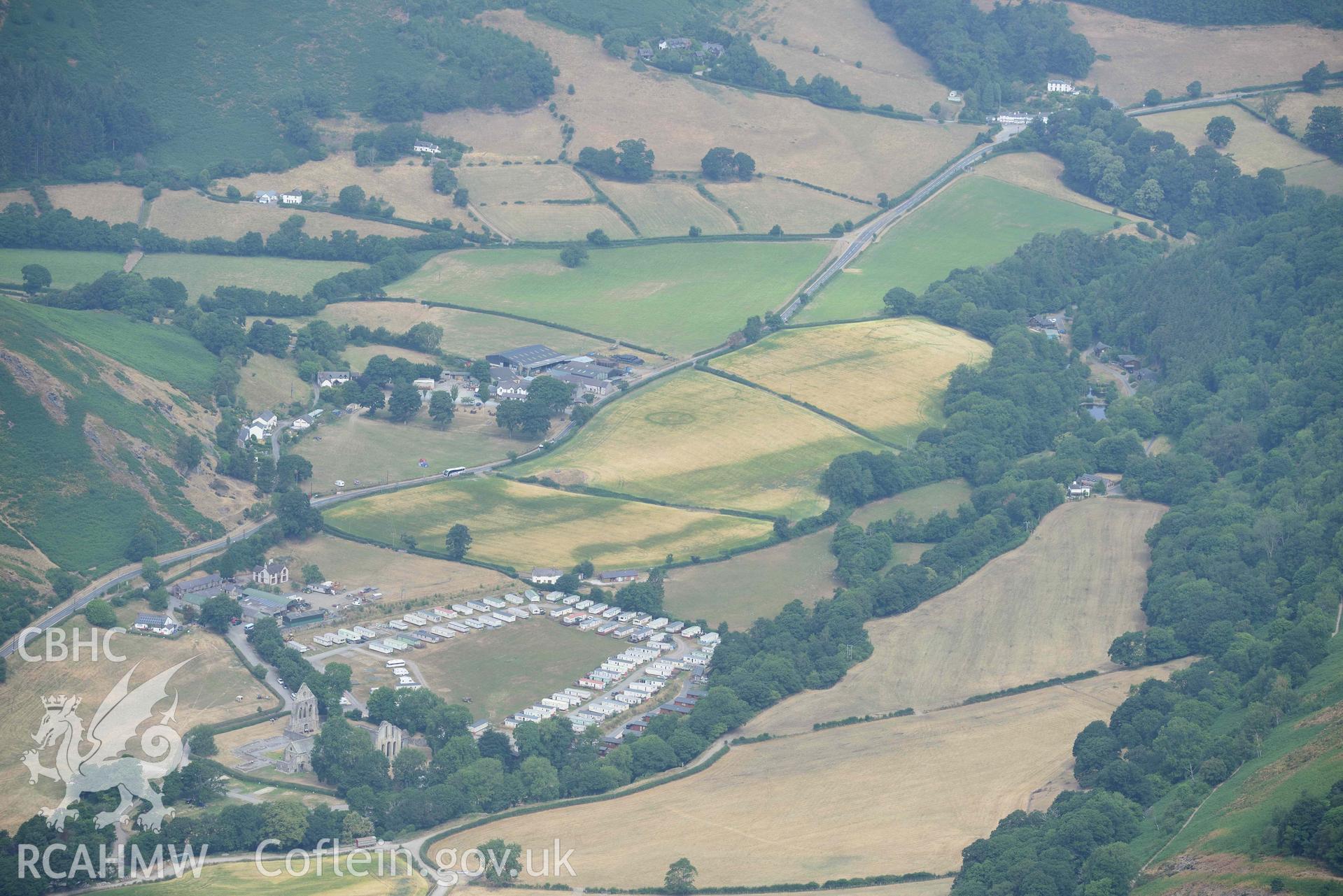 Vale Crucis Abbey and the Pillar of Eliseg. Oblique aerial photograph taken during the Royal Commission’s programme of archaeological aerial reconnaissance by Toby Driver on 10 July 2018.