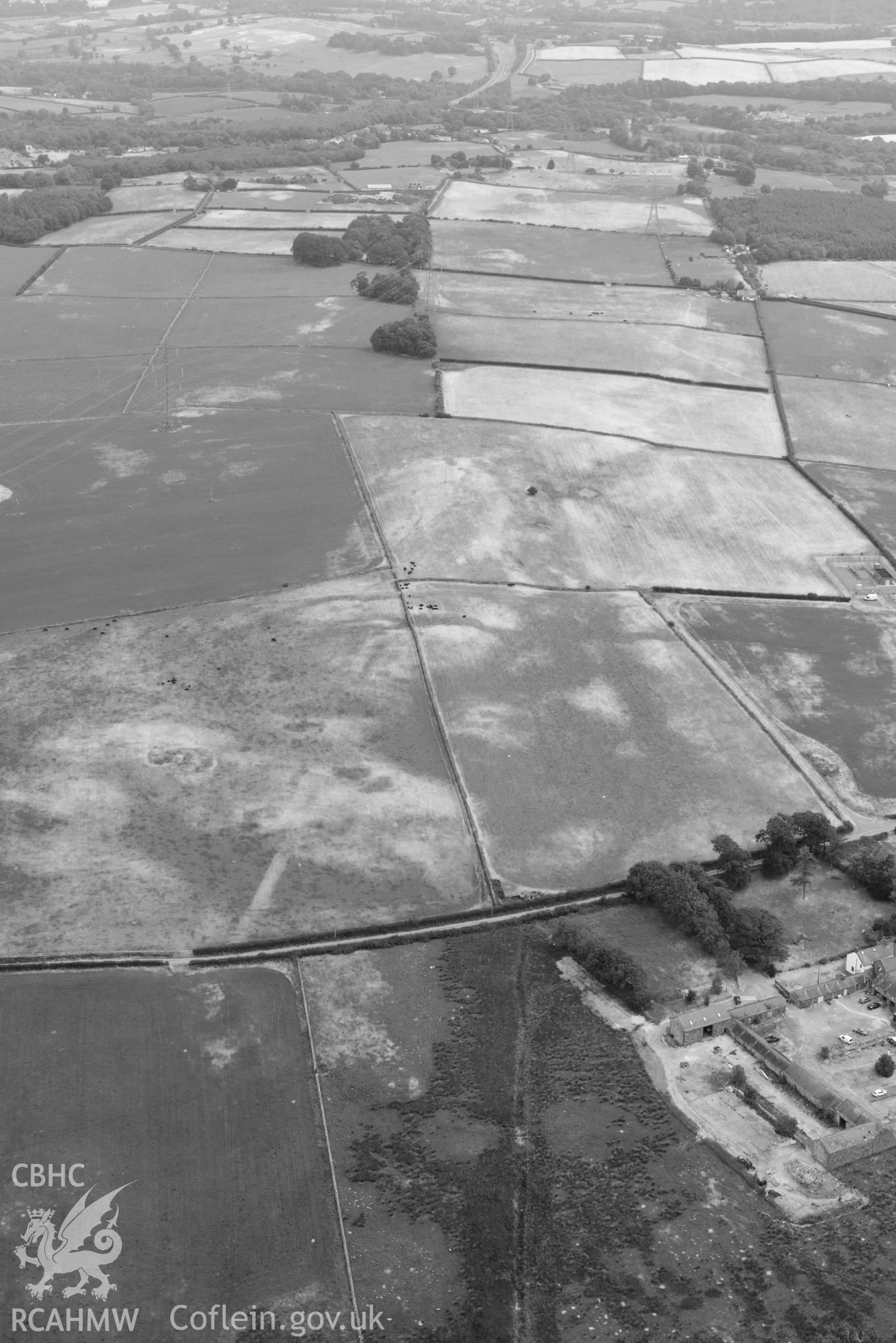 Ty'n Llwyn Roman Road. Oblique black and white aerial photograph taken during the Royal Commission’s programme of archaeological aerial reconnaissance by Toby Driver on 10 July 2018.