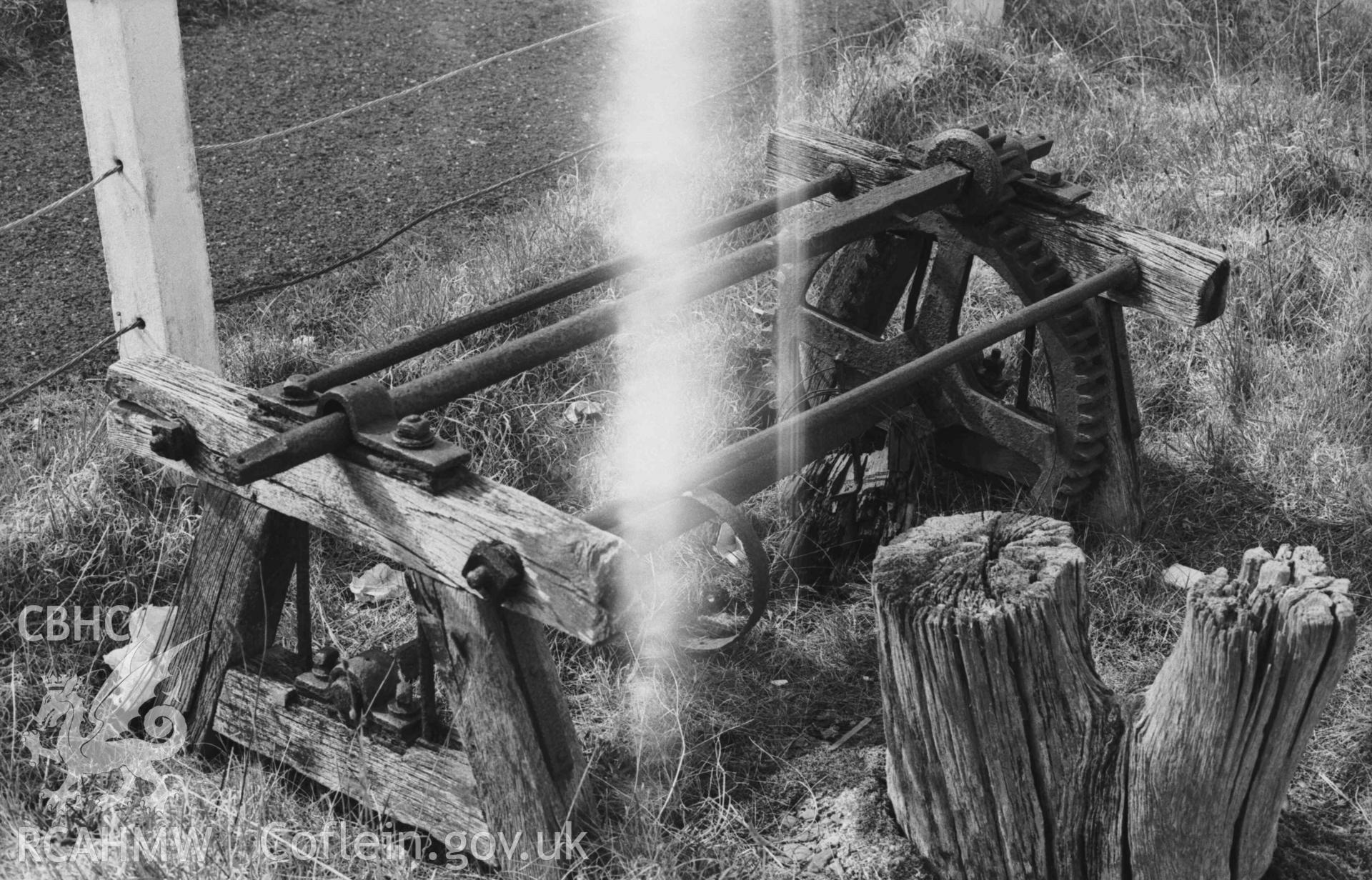 Digital copy of a black and white negative showing detailed view of remains of cable car winches at Aberaeron harbour. Photographed by Arthur Chater on 3 April 1969. Looking north from Grid Reference SN 4559 6285.