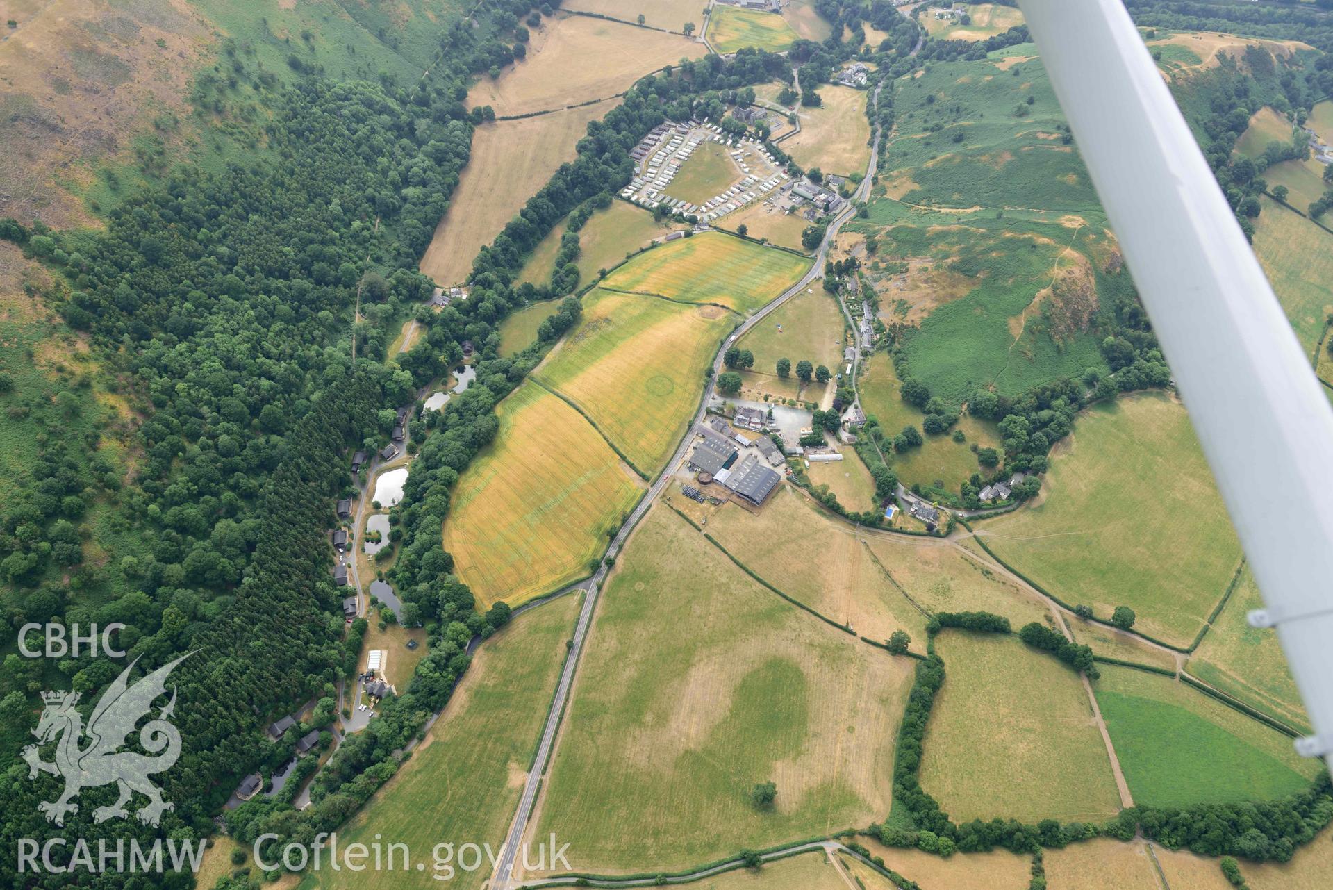 Pillar of Eliseg and Eliseg Ring Ditch. Oblique aerial photograph taken during the Royal Commission’s programme of archaeological aerial reconnaissance by Toby Driver on 10 July 2018.