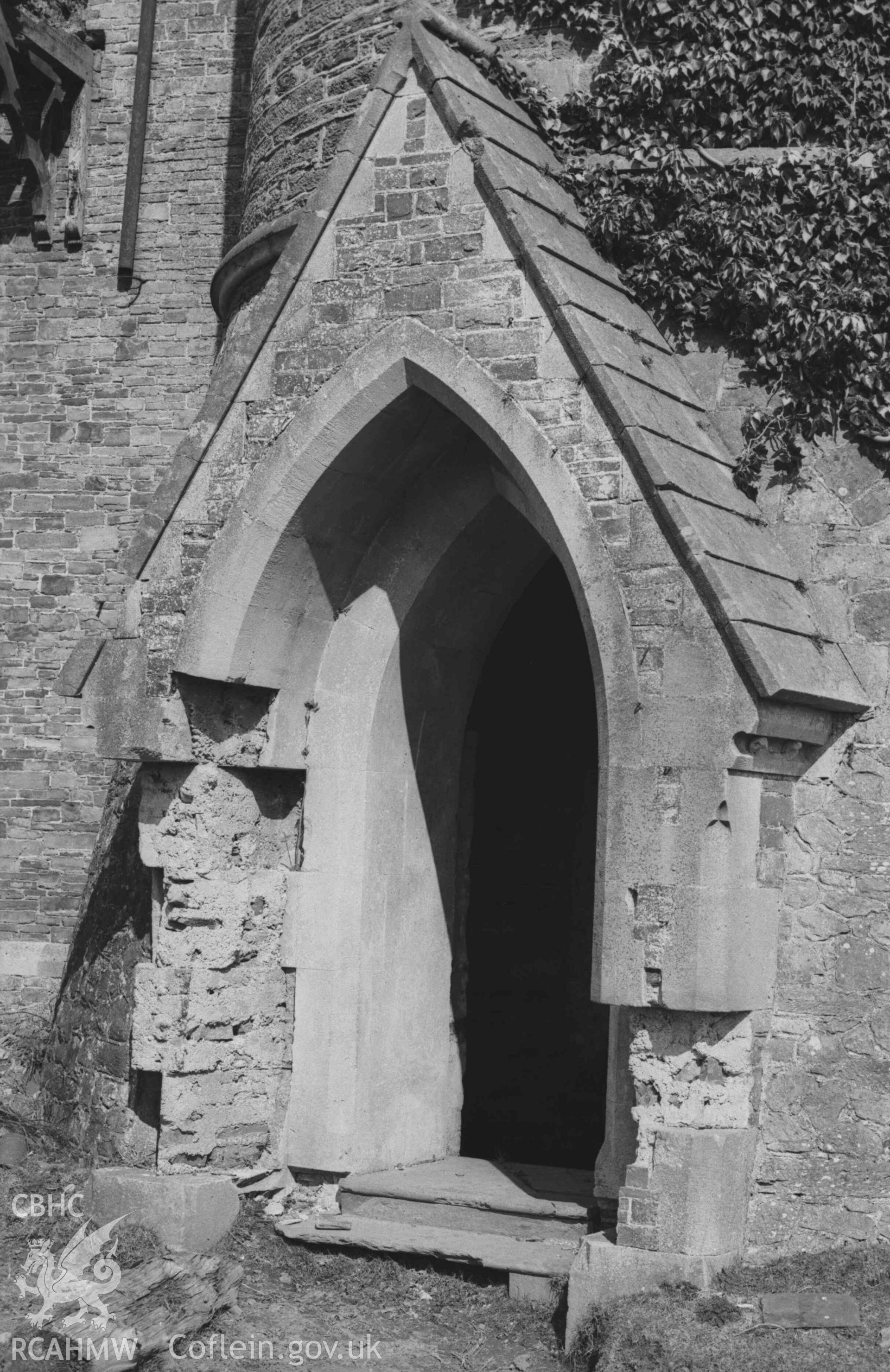 Digital copy of a black and white negative showing doorway at base of round tower at the south west corner of the Bronwydd ruins. Photographed by Arthur Chater on 5 April 1969. Looking east north east from Grid Reference SN 3531 4320.