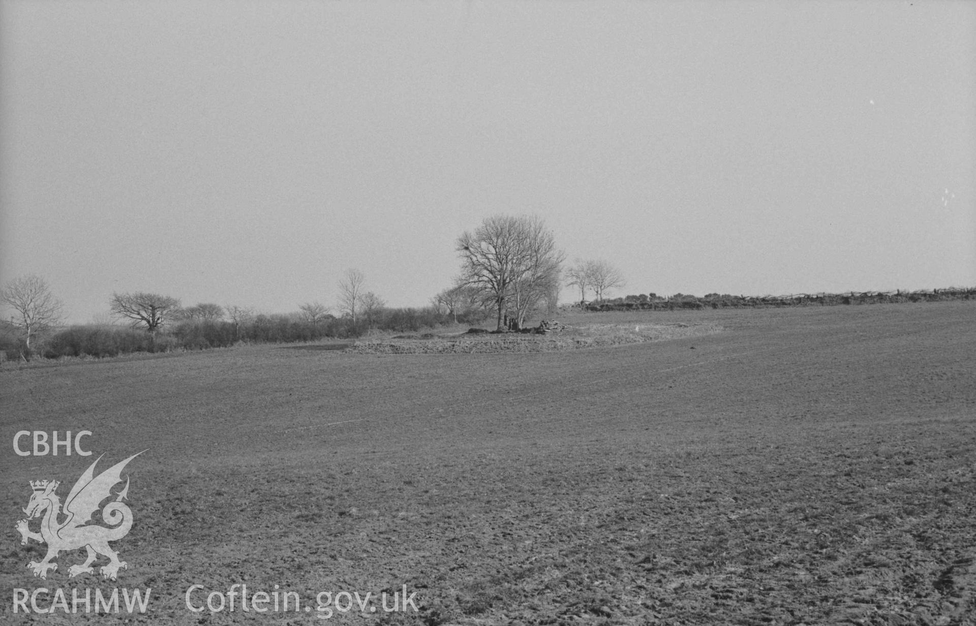 Digital copy of a black and white negative showing Llanfairtrefhelygen church ruins. Photographed by Arthur Chater on 5 April 1969. Looking south east from Grid Reference SN 3423 4424.