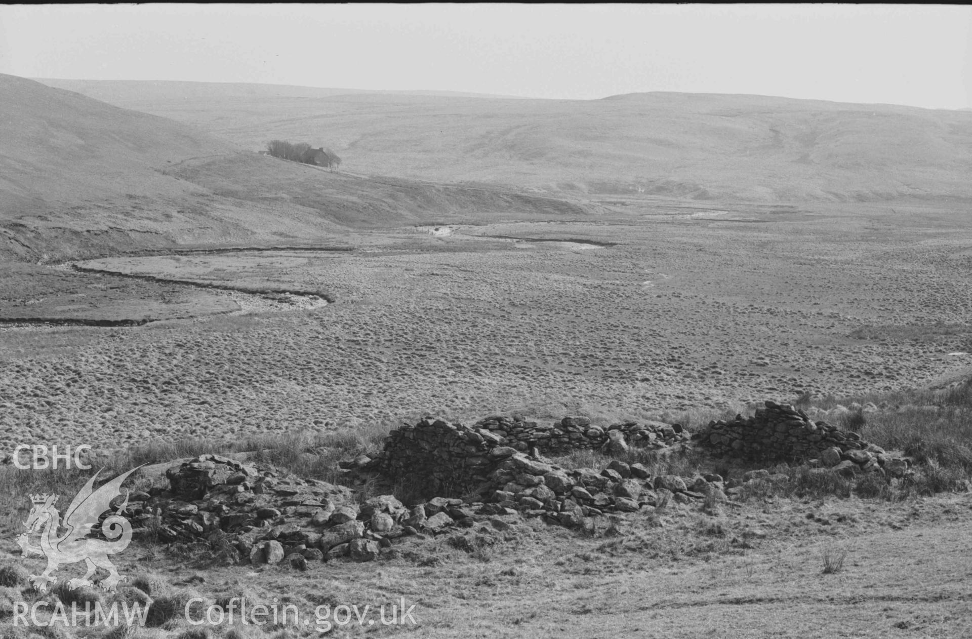 Digital copy of a black and white negative showing Claerwen farm and the Afon Claerwen, seen over the ruin of Hengae on the old road. Photographed by Arthur Chater on 8 April 1969. Looking south from Grid Reference SN 8203 6810.