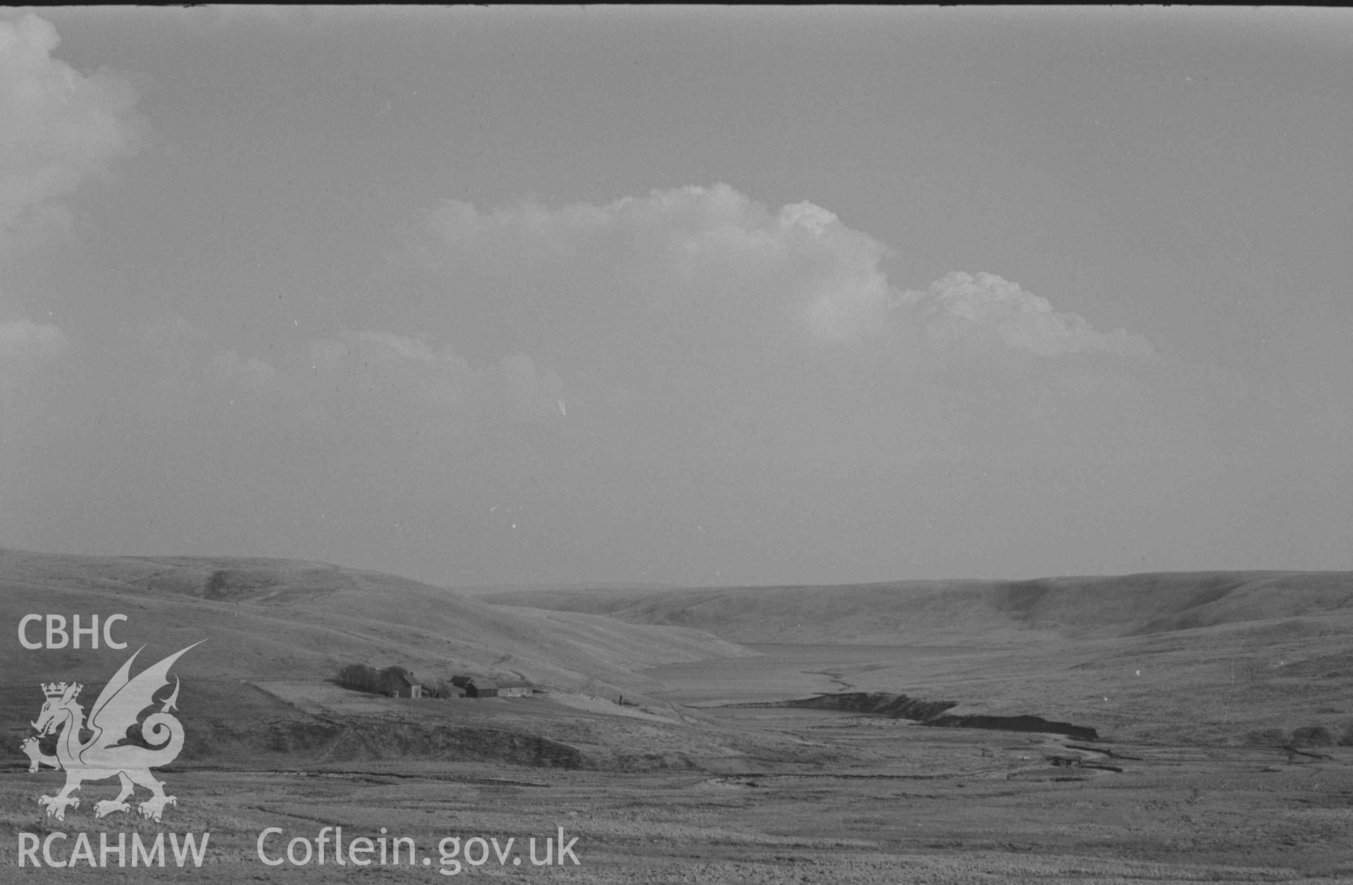 Digital copy of a black and white negative showing Claerwen Farm and Reservoir from the old road on Esgair Hengae. Photographed by Arthur Chater on 8 April 1969. Looking south east from Grid Reference SN 8150 6787.