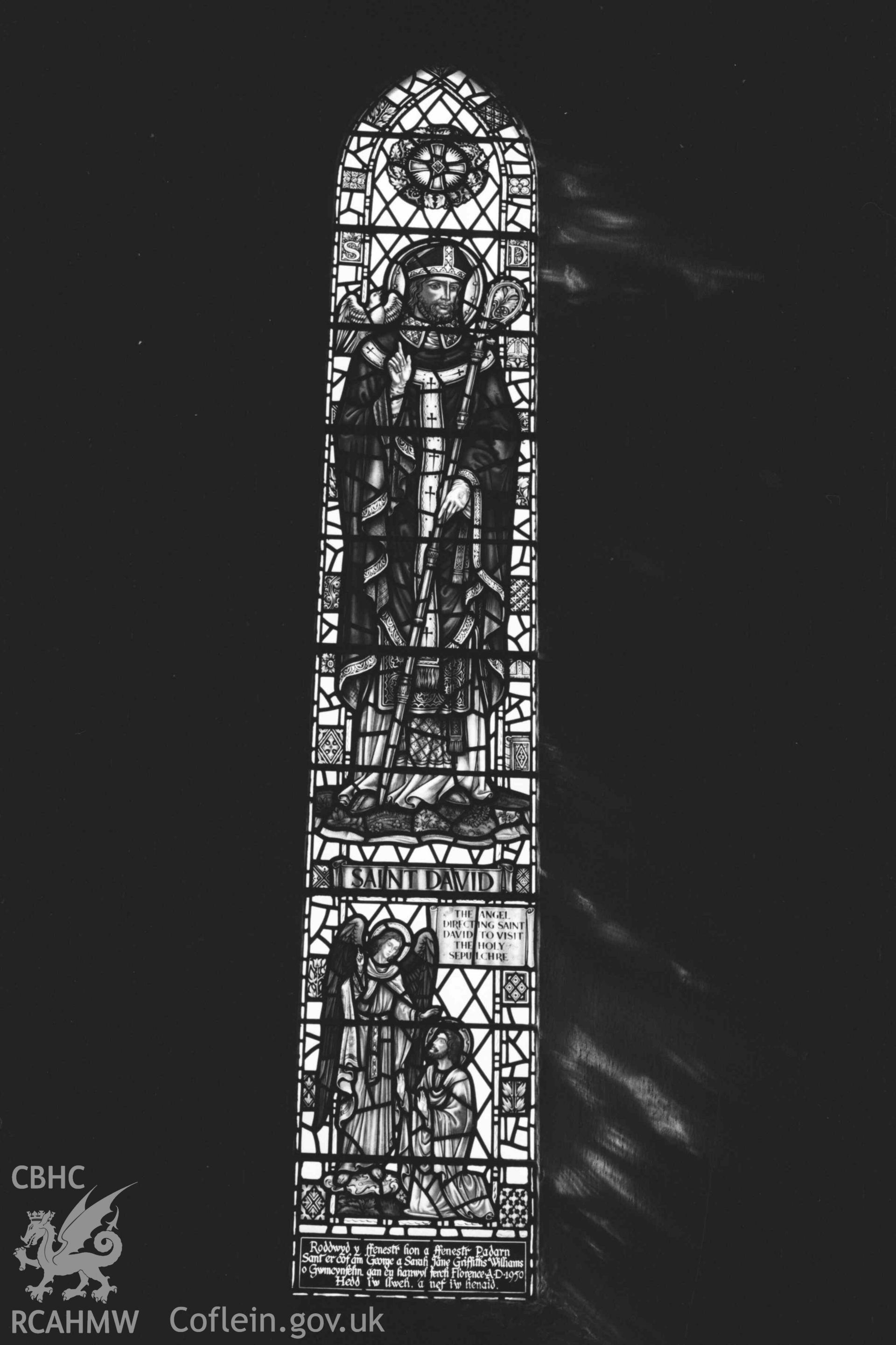 Digital copy of a black and white negative showing stained glass window in All Saints' Churchyard, Llangorwen. Photographed by Arthur Chater on 12 April 1969. Grid Reference SN 6033 8383.