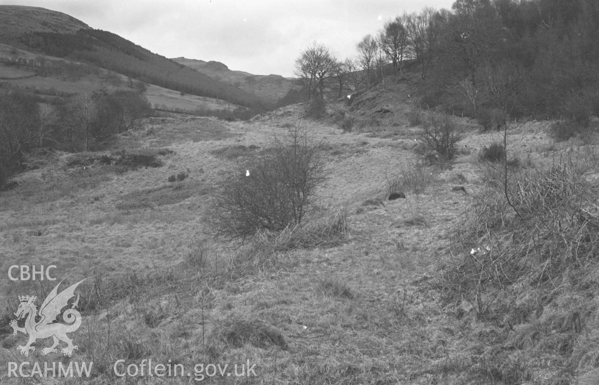 Digital copy of a black and white negative showing track of Hafan-Llandre railway from 200m west of Capel Bethesda. Photographed by Arthur Chater on 13 April 1969. Looking east from Grid Reference SN 6919 8849.