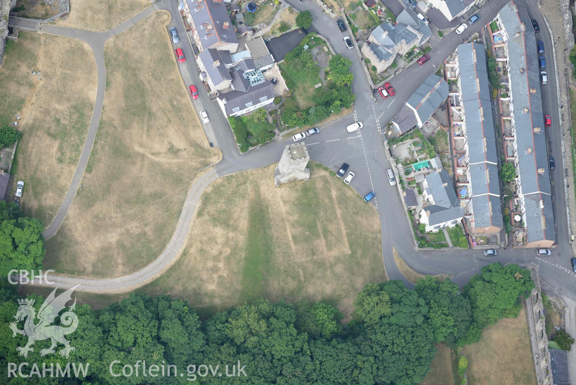 Denbigh Castle and St Hilary's Chapel. Oblique aerial photograph taken during the Royal Commission