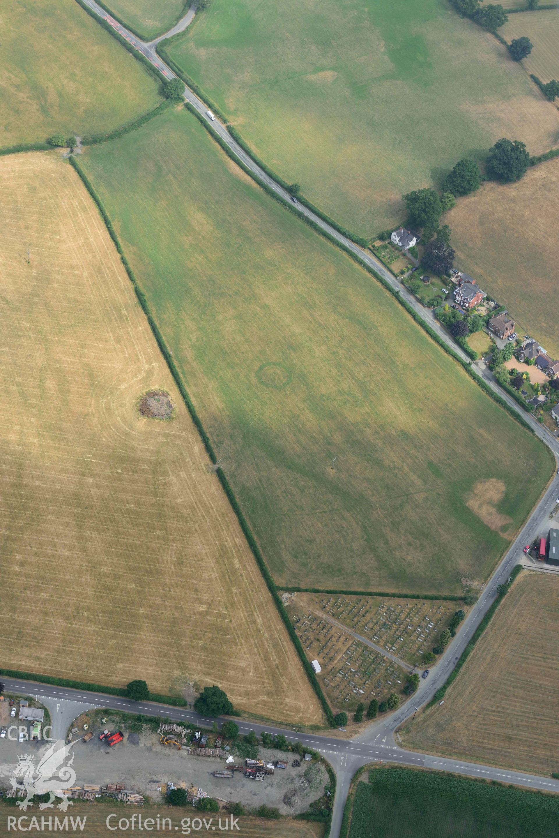 Llanrhaeadr ym Mochnant cropmarks. Oblique aerial photograph taken during the Royal Commission’s programme of archaeological aerial reconnaissance by Toby Driver on 10 July 2018.