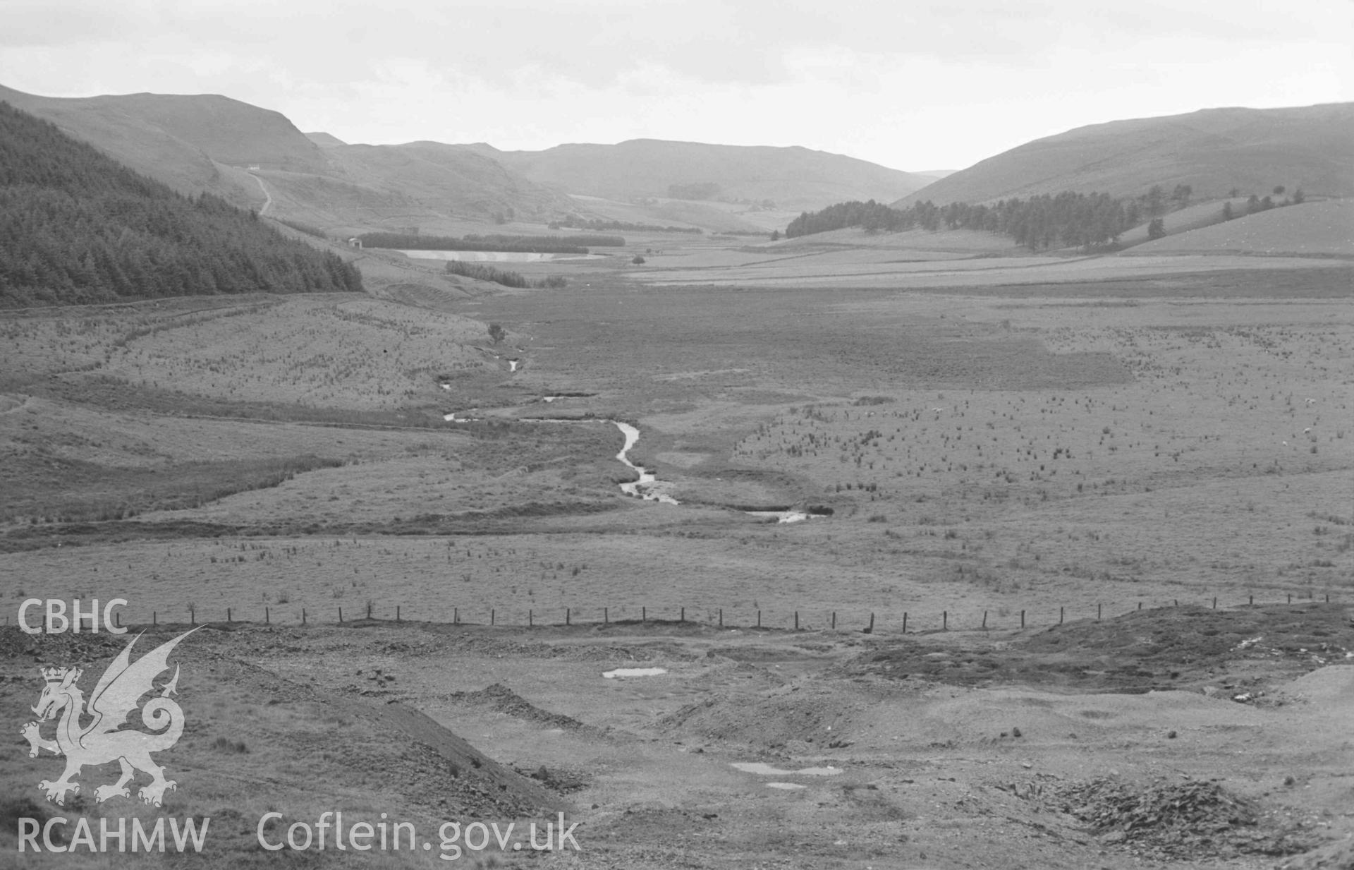 Digital copy of a black and white negative showing view down the Afon Castell from the lead mine. Photographed by Arthur Chater on 25 August 1969. Looking south west from Grid Reference SN 7912 8278.