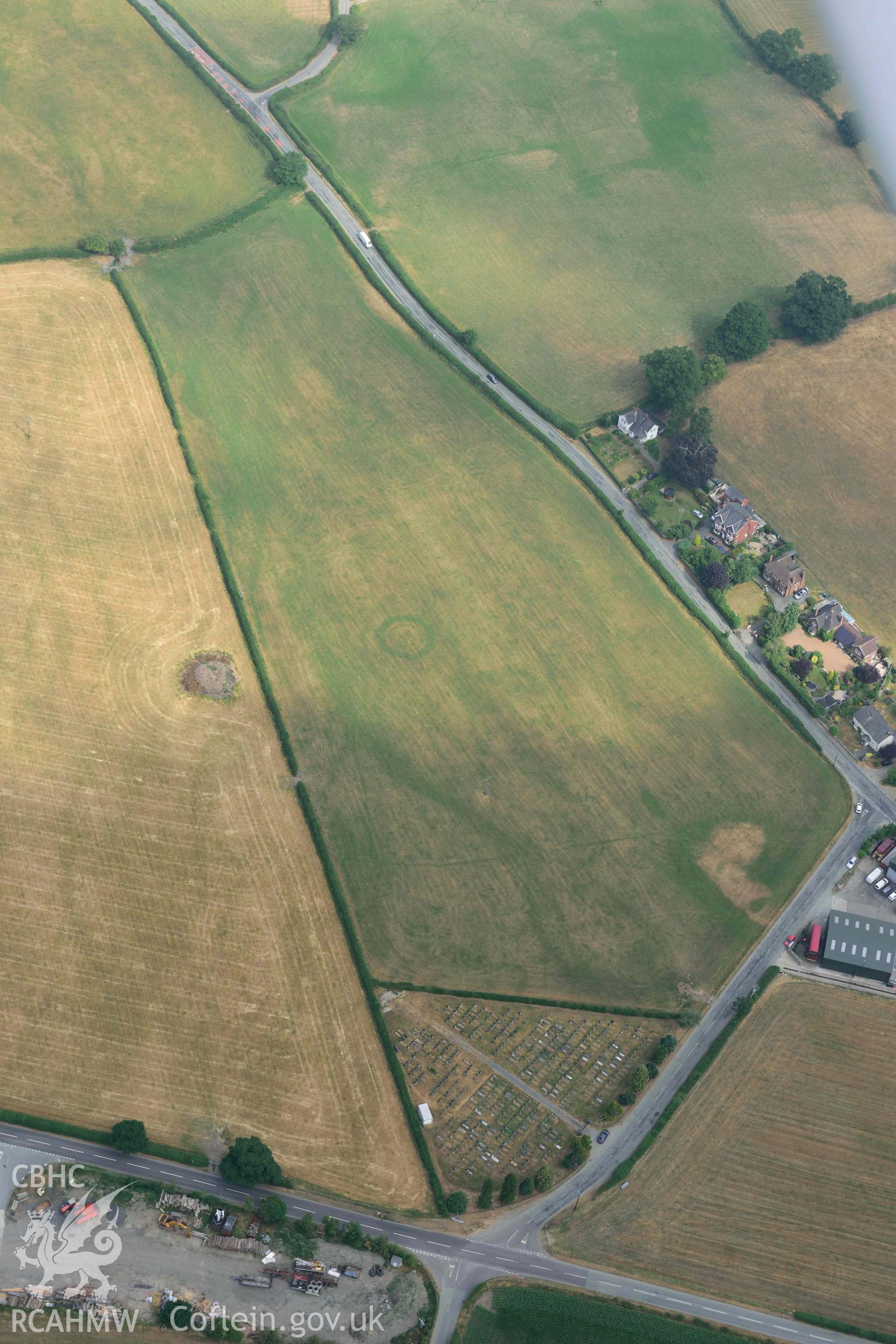 Llanrhaeadr ym Mochnant cropmarks. Oblique aerial photograph taken during the Royal Commission’s programme of archaeological aerial reconnaissance by Toby Driver on 10 July 2018.