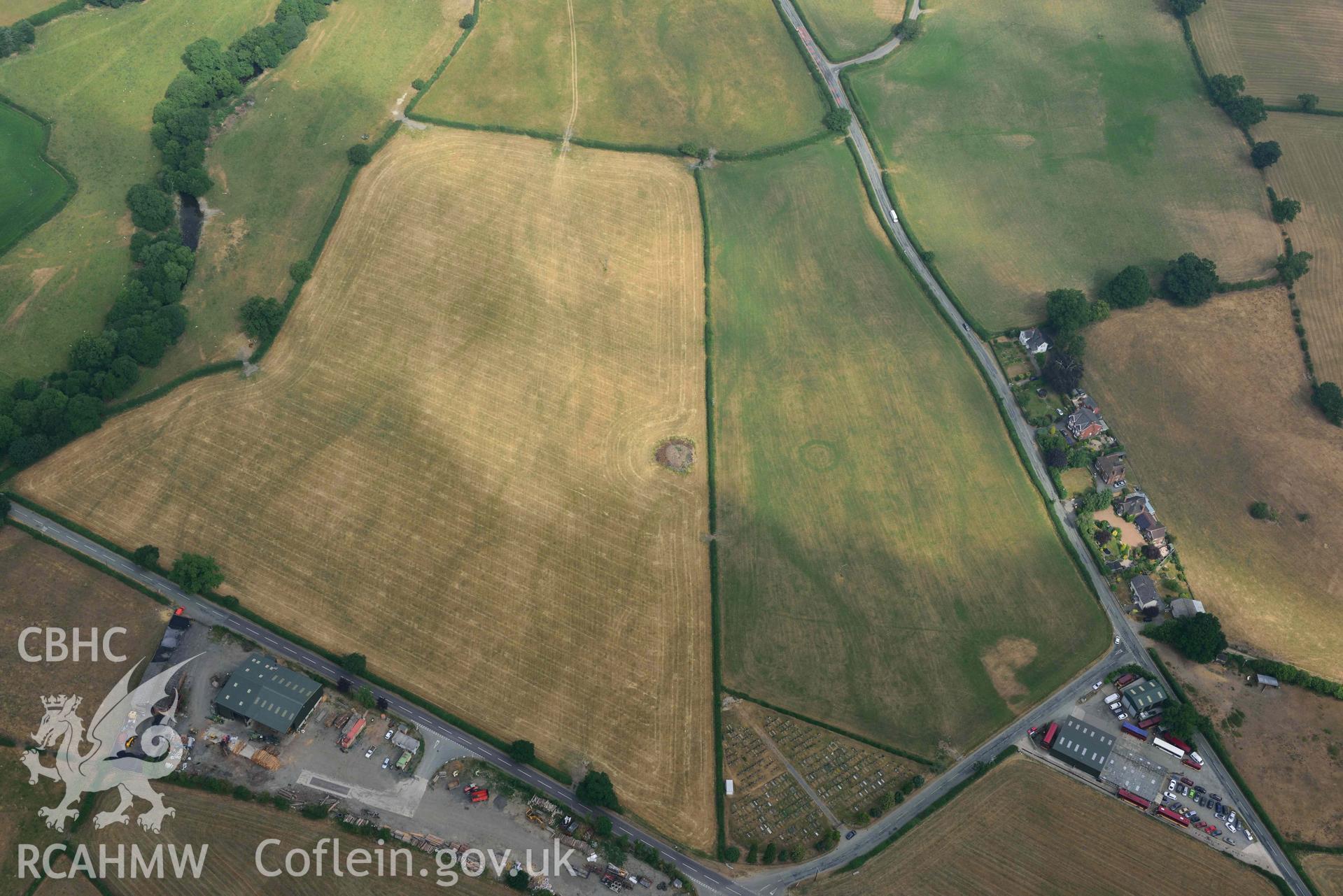 Llanrhaeadr ym Mochnant cropmarks. Oblique aerial photograph taken during the Royal Commission’s programme of archaeological aerial reconnaissance by Toby Driver on 10 July 2018.