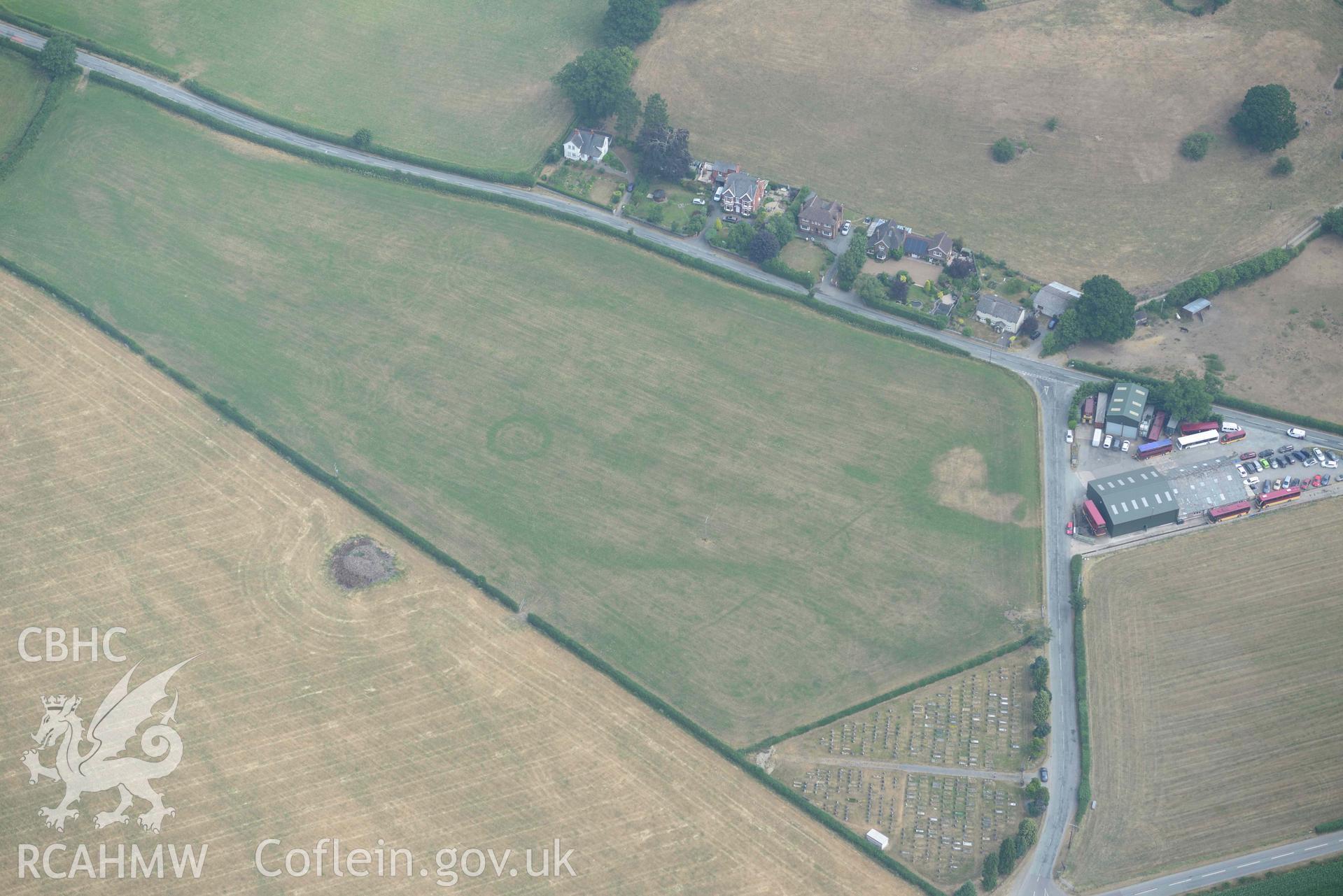 Llanrhaeadr ym Mochnant cropmarks. Oblique aerial photograph taken during the Royal Commission’s programme of archaeological aerial reconnaissance by Toby Driver on 10 July 2018.