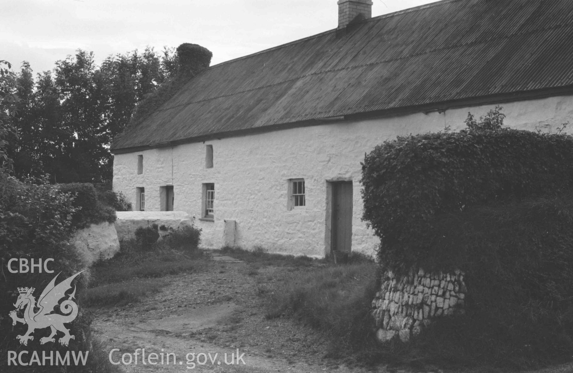 Digital copy of a black and white negative showing old cottages 100m south east of the crossroads at Caerwedros. Photographed by Arthur Chater on 28 August 1969, from Grid Reference SN 3771 5578.