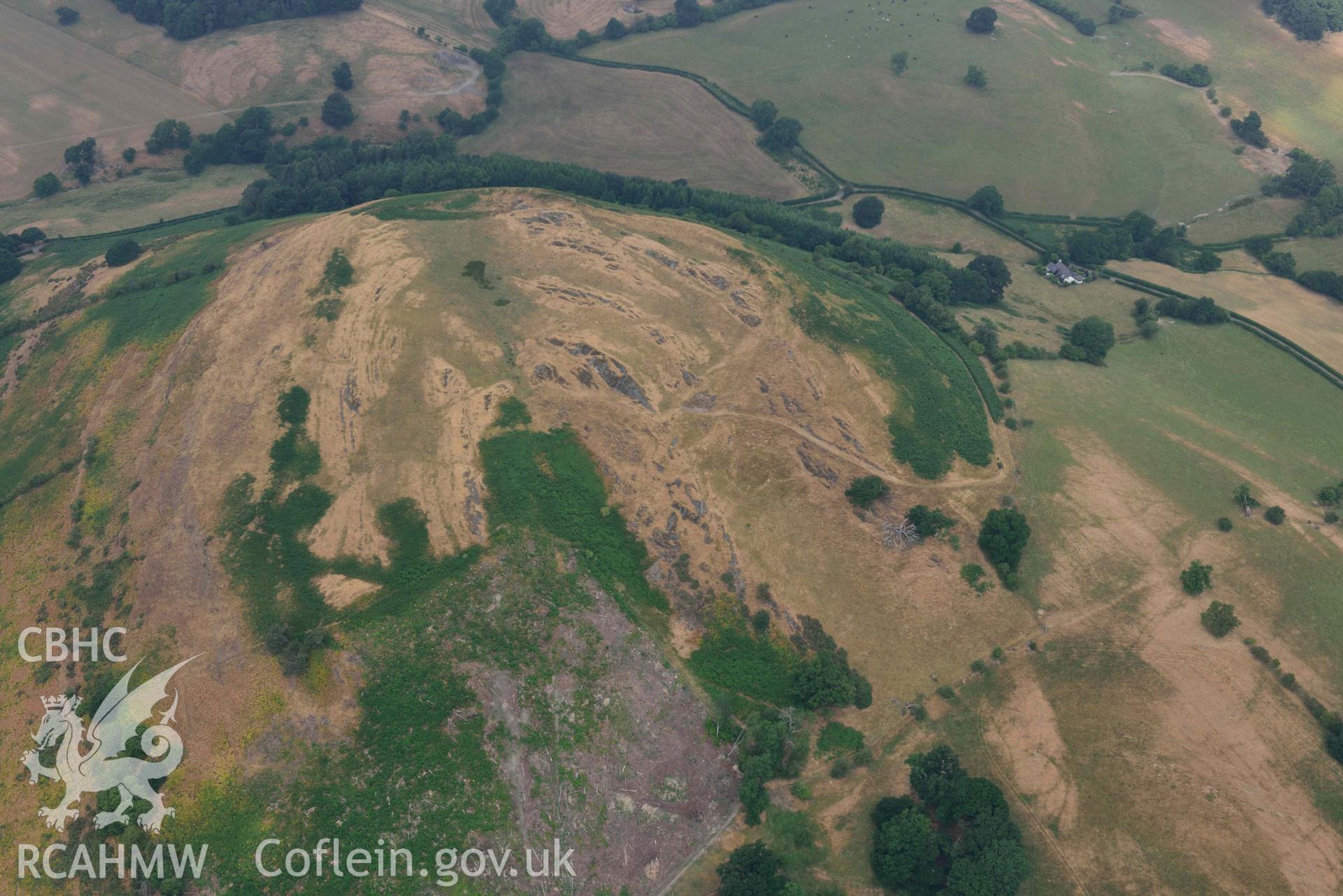 Llwyn Bryn Dinas. Oblique aerial photograph taken during the Royal Commission’s programme of archaeological aerial reconnaissance by Toby Driver on 10 July 2018.