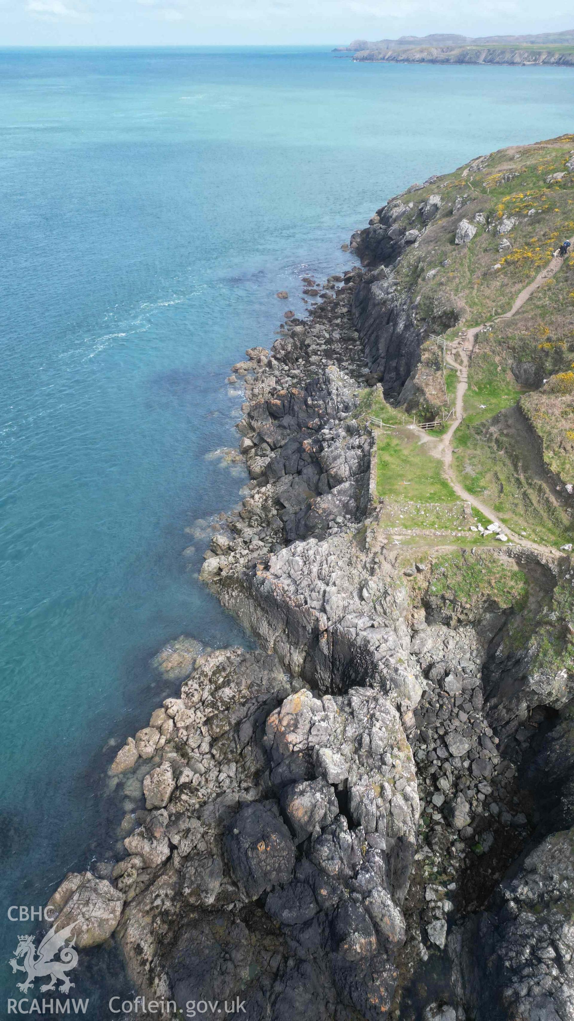 Oblique view, looking north, of Penmaenmelyn copper mine on 24/04/2024. Point St John and St Davids Head are visible in the background.