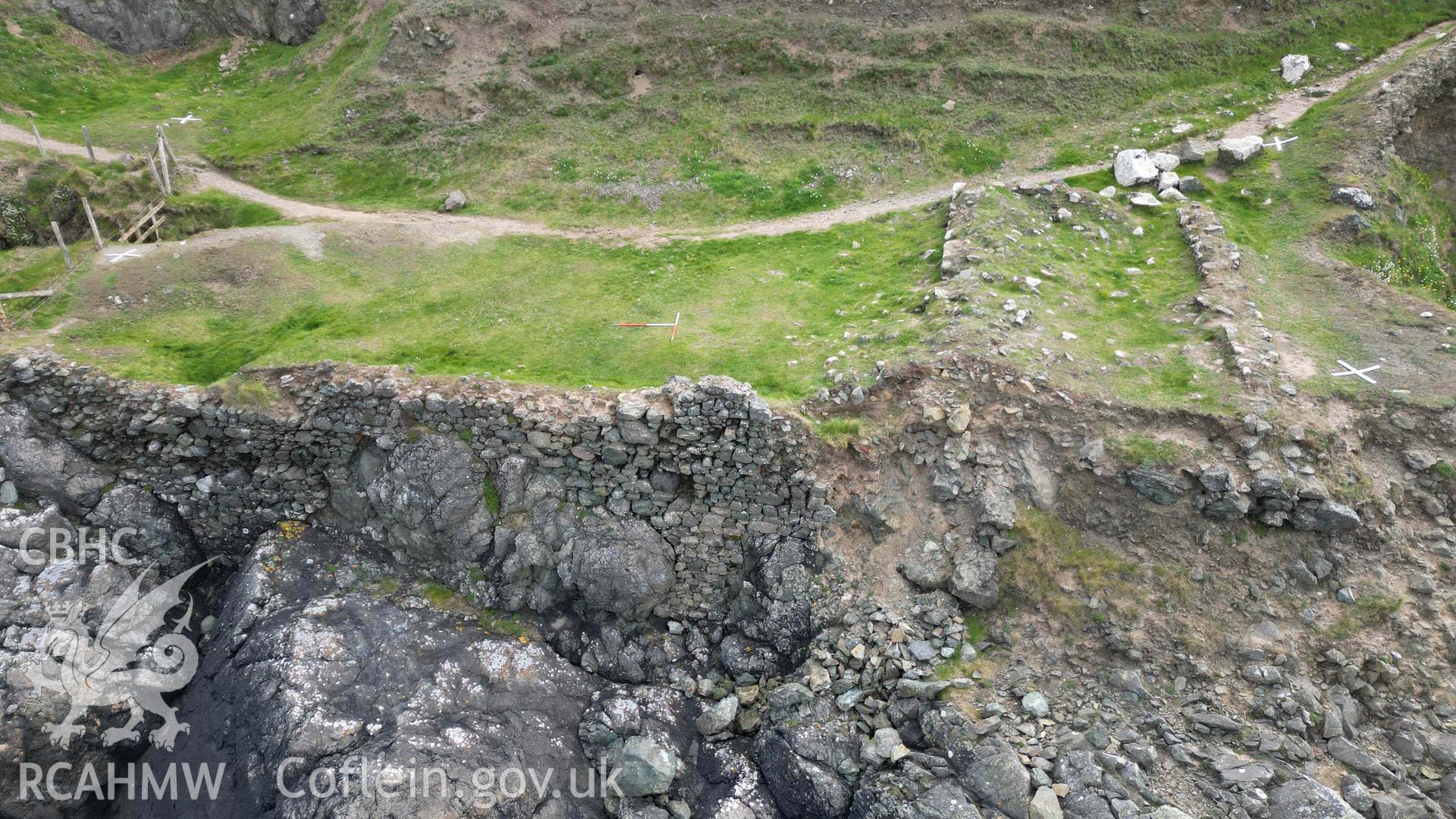 Low-level oblique view, looking east, of Penmaenmelyn copper mine on 24/04/2024. Localised collapse of the retaining western wall has taken place at its southern end. Scales are 1m.