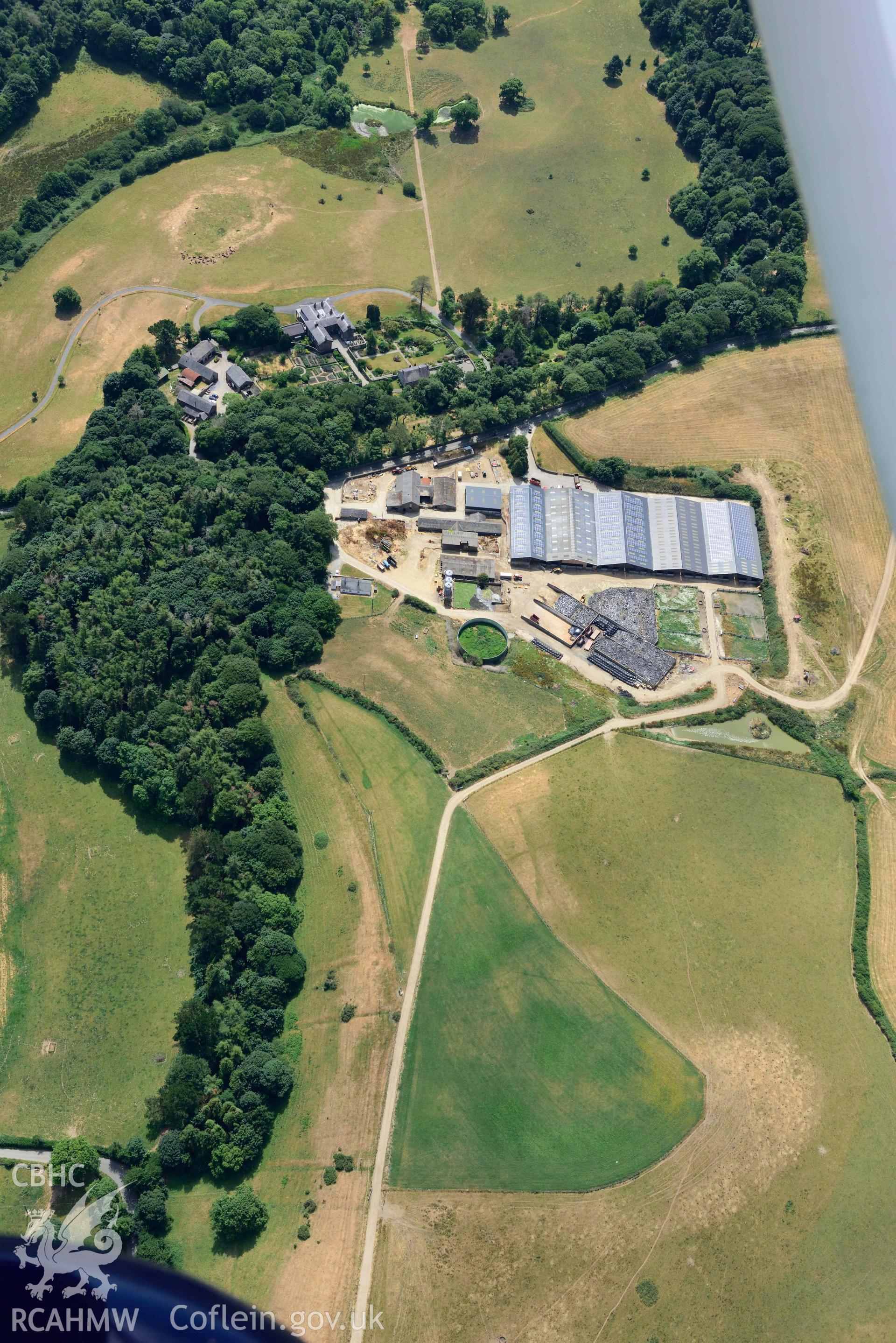 Garden at Nanhoron, including cropmarks of relict field systems. Oblique aerial photograph taken during the Royal Commission’s programme of archaeological aerial reconnaissance by Toby Driver on 10 July 2018.