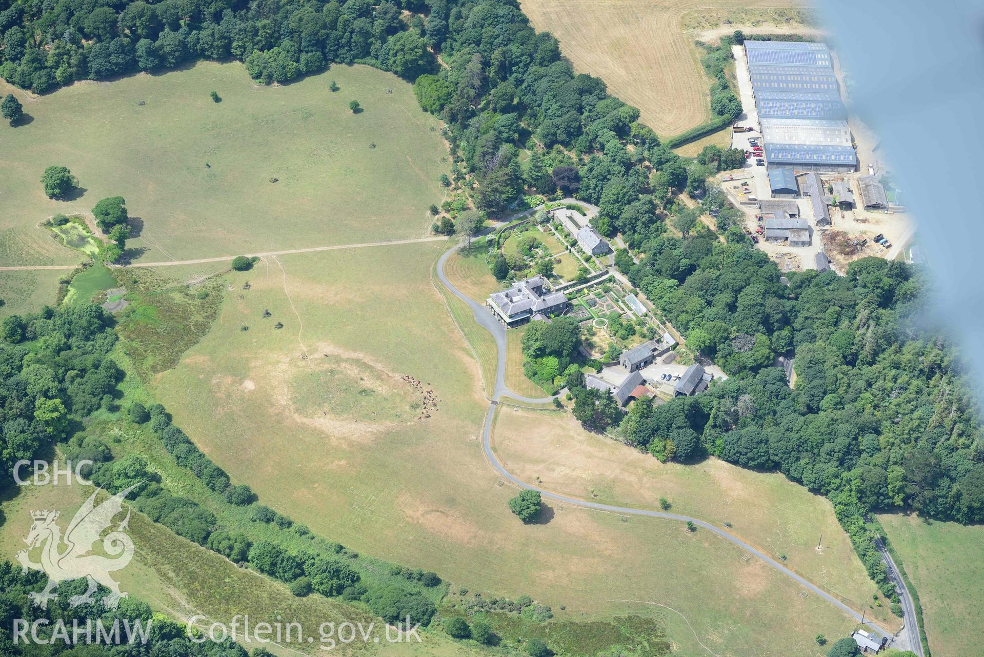 Garden at Nanhoron, including cropmarks of relict field systems. Oblique aerial photograph taken during the Royal Commission’s programme of archaeological aerial reconnaissance by Toby Driver on 10 July 2018.