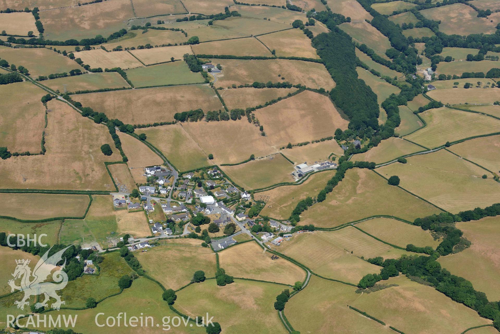 Llanfihangel y Creuddyn village. Oblique aerial photograph taken during the Royal Commission’s programme of archaeological aerial reconnaissance by Toby Driver on 10 July 2018.