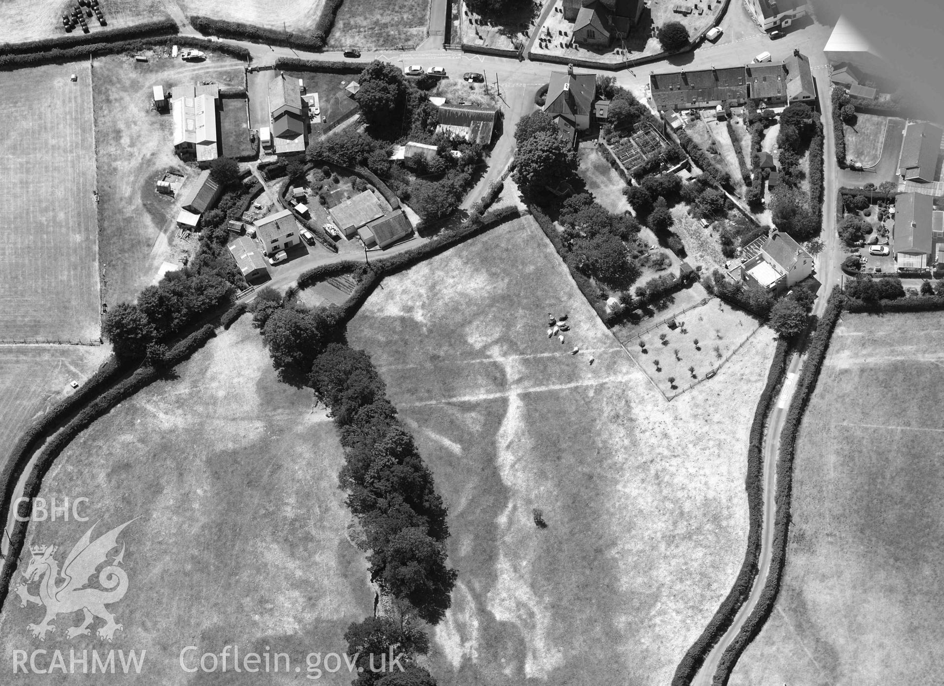 Detailed view of cropmark in field immediately adjacent to Lisburne House, Llanfihangel y Creuddyn. Oblique black and white aerial photograph taken during the Royal Commission’s programme of archaeological aerial reconnaissance by Toby Driver on 10 July 2018.