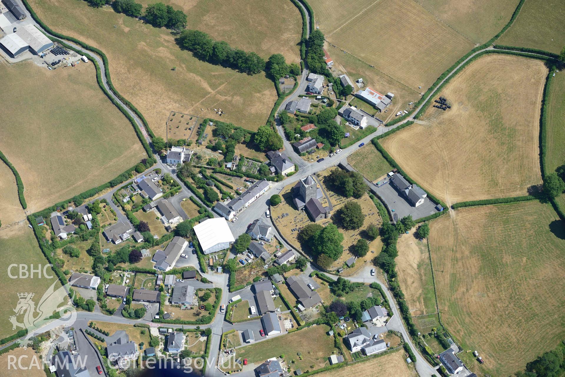 St Michael's Church, Llanfihangel y Creuddyn. Oblique black and white aerial photograph taken during the Royal Commission’s programme of archaeological aerial reconnaissance by Toby Driver on 10 July 2018.