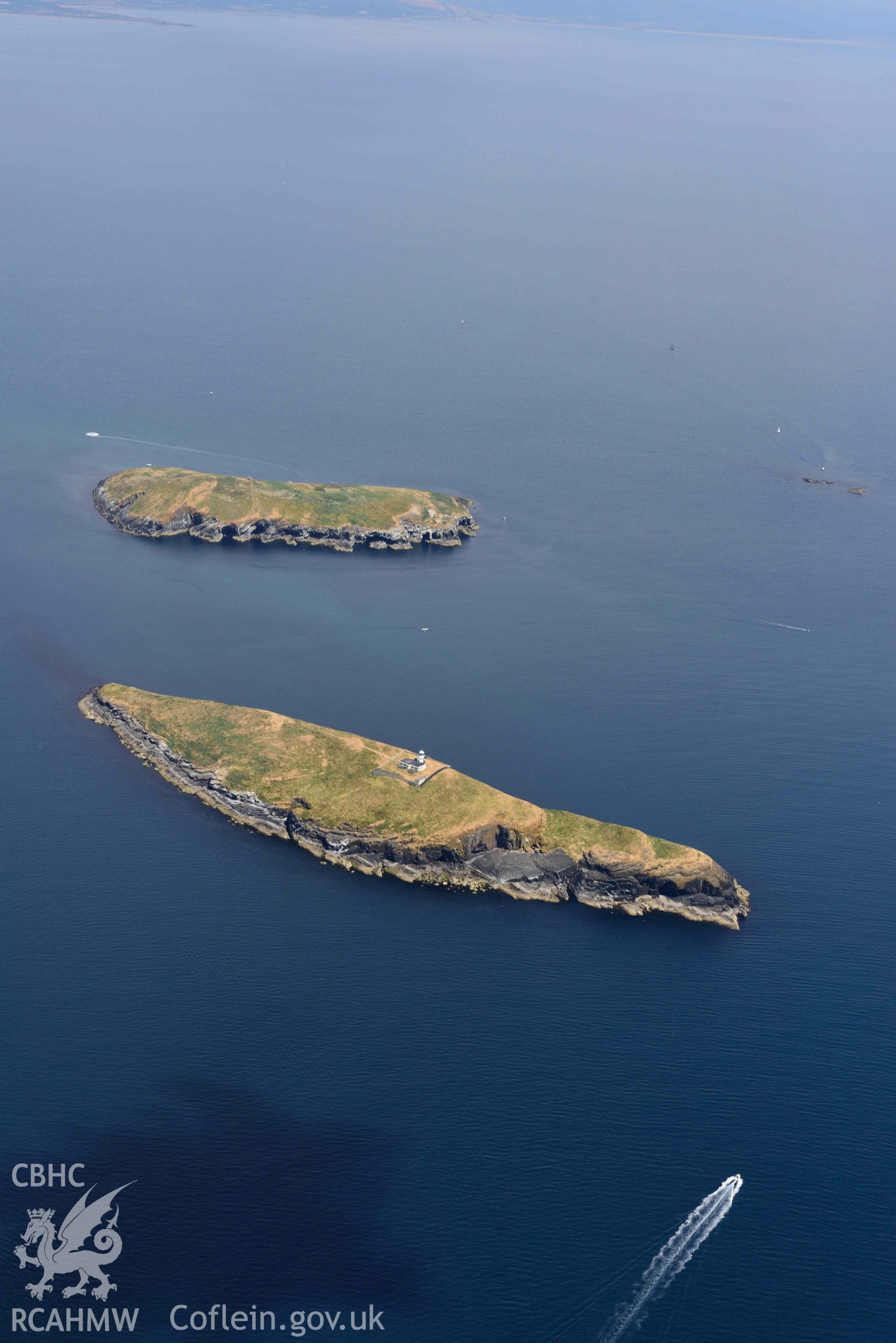 St Tudwals Island West (in foreground) and East. Oblique aerial photograph taken during the Royal Commission’s programme of archaeological aerial reconnaissance by Toby Driver on 10 July 2018.