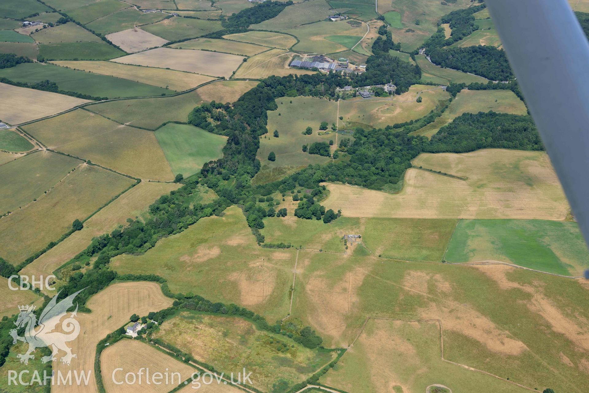 Circular cropmark enclosure on site of Capel Gwerthyr chapel. Oblique aerial photograph taken during the Royal Commission’s programme of archaeological aerial reconnaissance by Toby Driver on 10 July 2018.