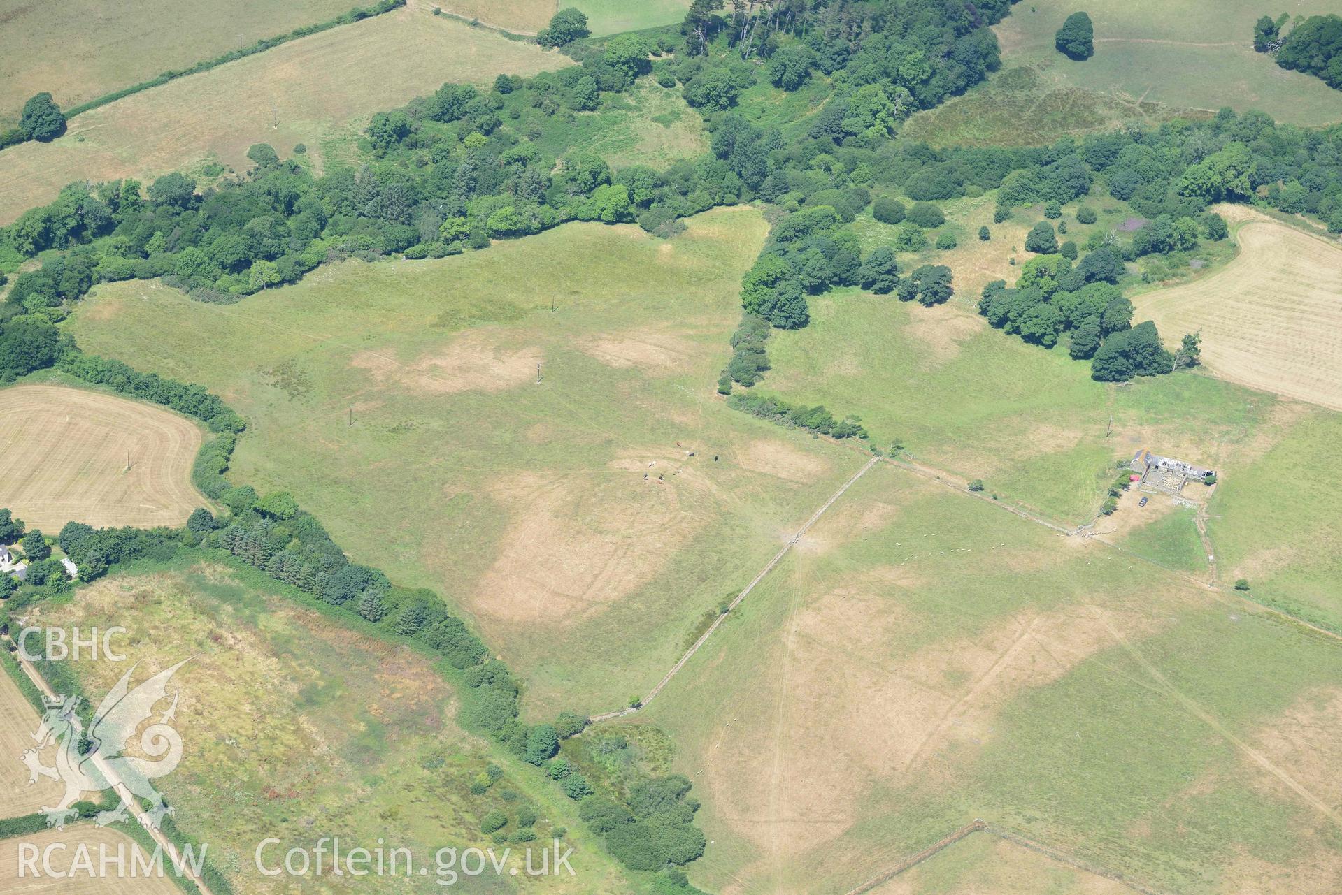 Circular cropmark enclosure on site of Capel Gwerthyr chapel. Oblique aerial photograph taken during the Royal Commission’s programme of archaeological aerial reconnaissance by Toby Driver on 10 July 2018.