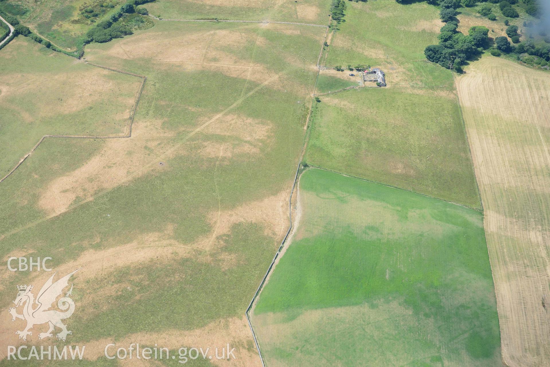 Circular cropmark enclosure on site of Capel Gwerthyr chapel. Oblique aerial photograph taken during the Royal Commission’s programme of archaeological aerial reconnaissance by Toby Driver on 10 July 2018.