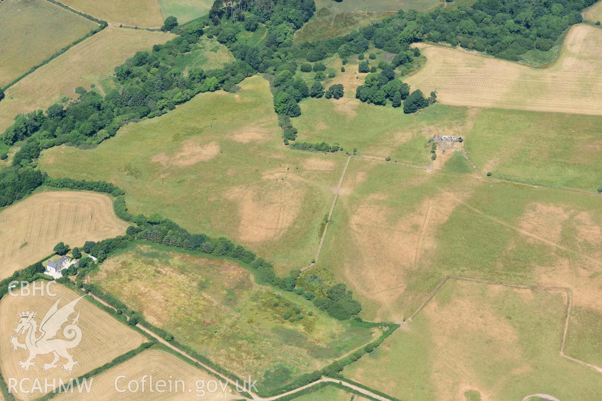 Circular cropmark enclosure on site of Capel Gwerthyr chapel. Oblique aerial photograph taken during the Royal Commission’s programme of archaeological aerial reconnaissance by Toby Driver on 10 July 2018.