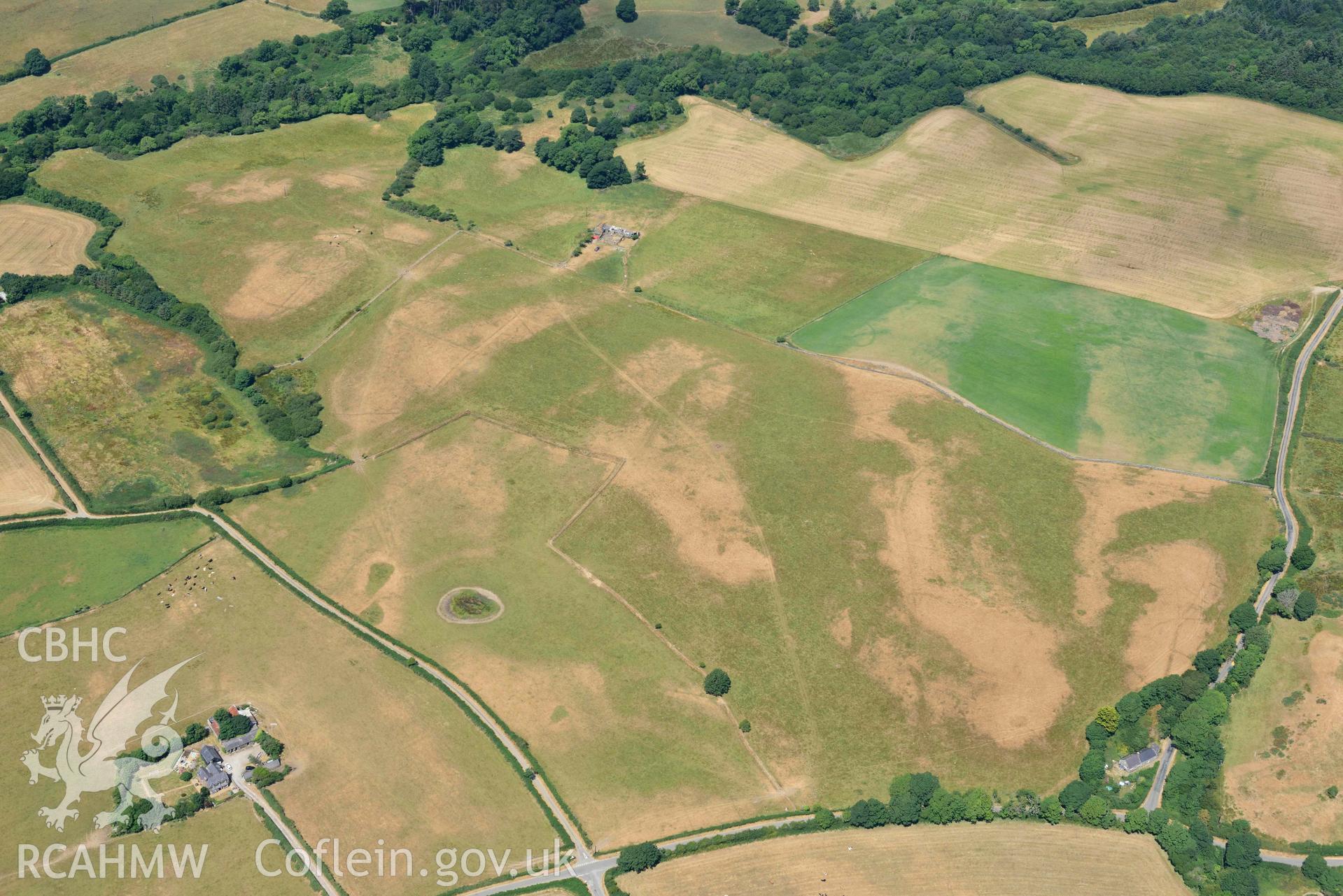 Circular cropmark enclosure on site of Capel Gwerthyr chapel. Oblique aerial photograph taken during the Royal Commission’s programme of archaeological aerial reconnaissance by Toby Driver on 10 July 2018.