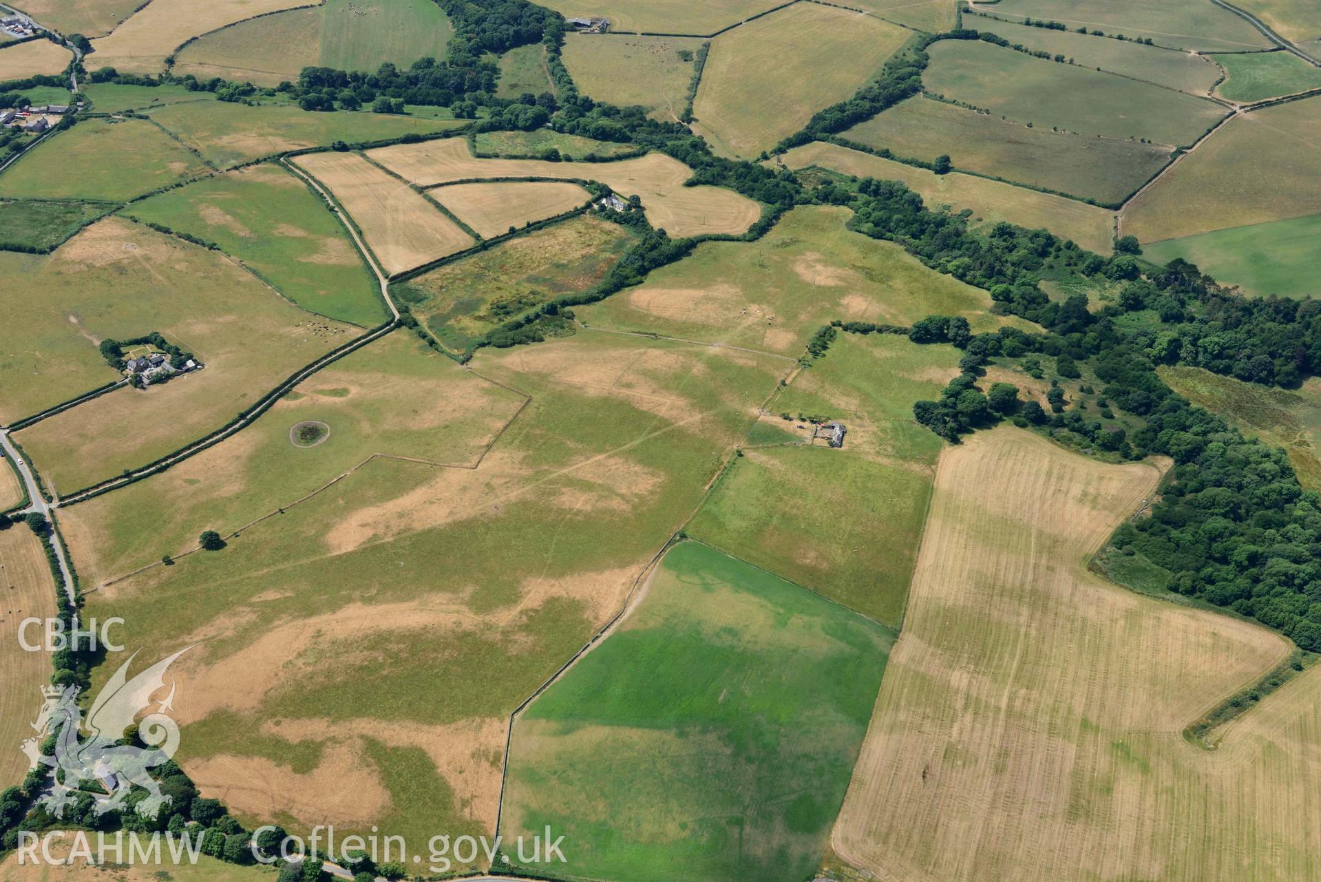 Circular cropmark enclosure on site of Capel Gwerthyr chapel. Oblique aerial photograph taken during the Royal Commission’s programme of archaeological aerial reconnaissance by Toby Driver on 10 July 2018.