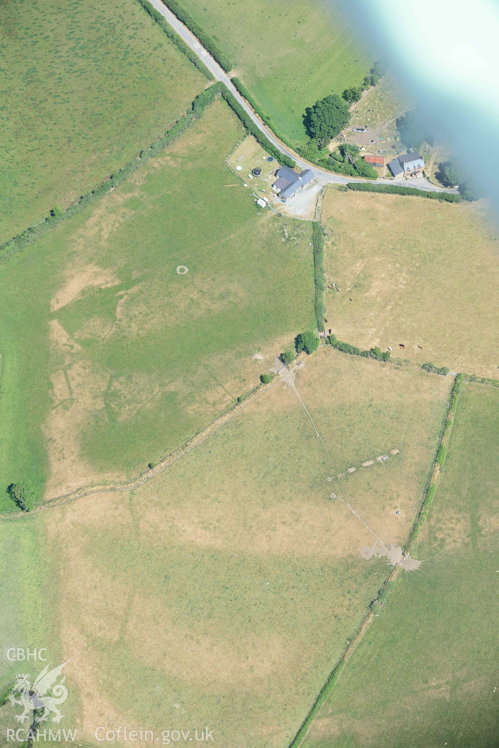 St Gwynnins Church and Tyn Llan square enclosure. Oblique aerial photograph taken during the Royal Commission’s programme of archaeological aerial reconnaissance by Toby Driver on 10 July 2018.