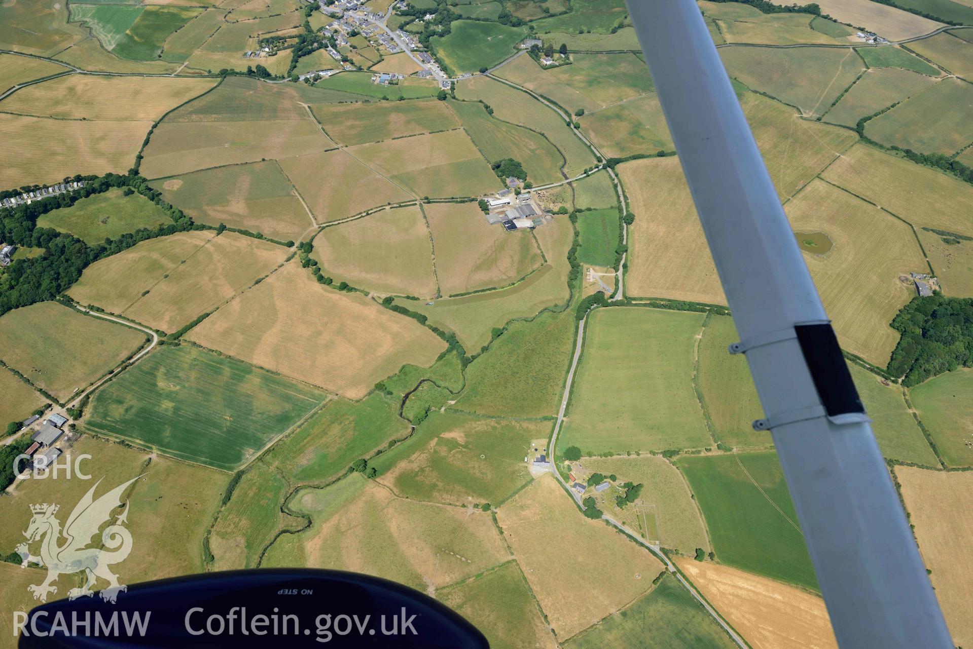 St Gwynnins Church and Tyn Llan square enclosure. Oblique aerial photograph taken during the Royal Commission’s programme of archaeological aerial reconnaissance by Toby Driver on 10 July 2018.