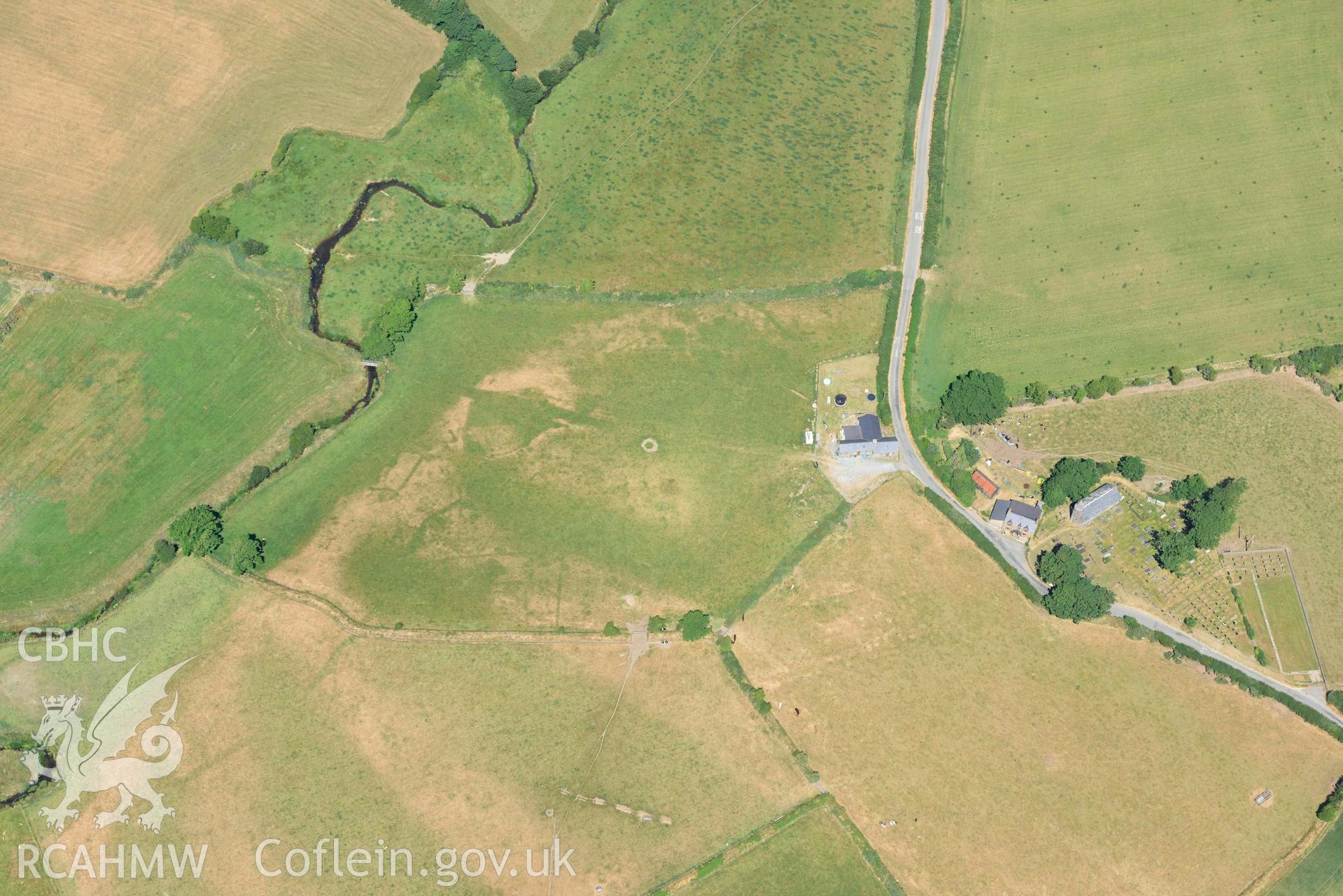 St Gwynnins Church and Tyn Llan square enclosure. Oblique aerial photograph taken during the Royal Commission’s programme of archaeological aerial reconnaissance by Toby Driver on 10 July 2018.